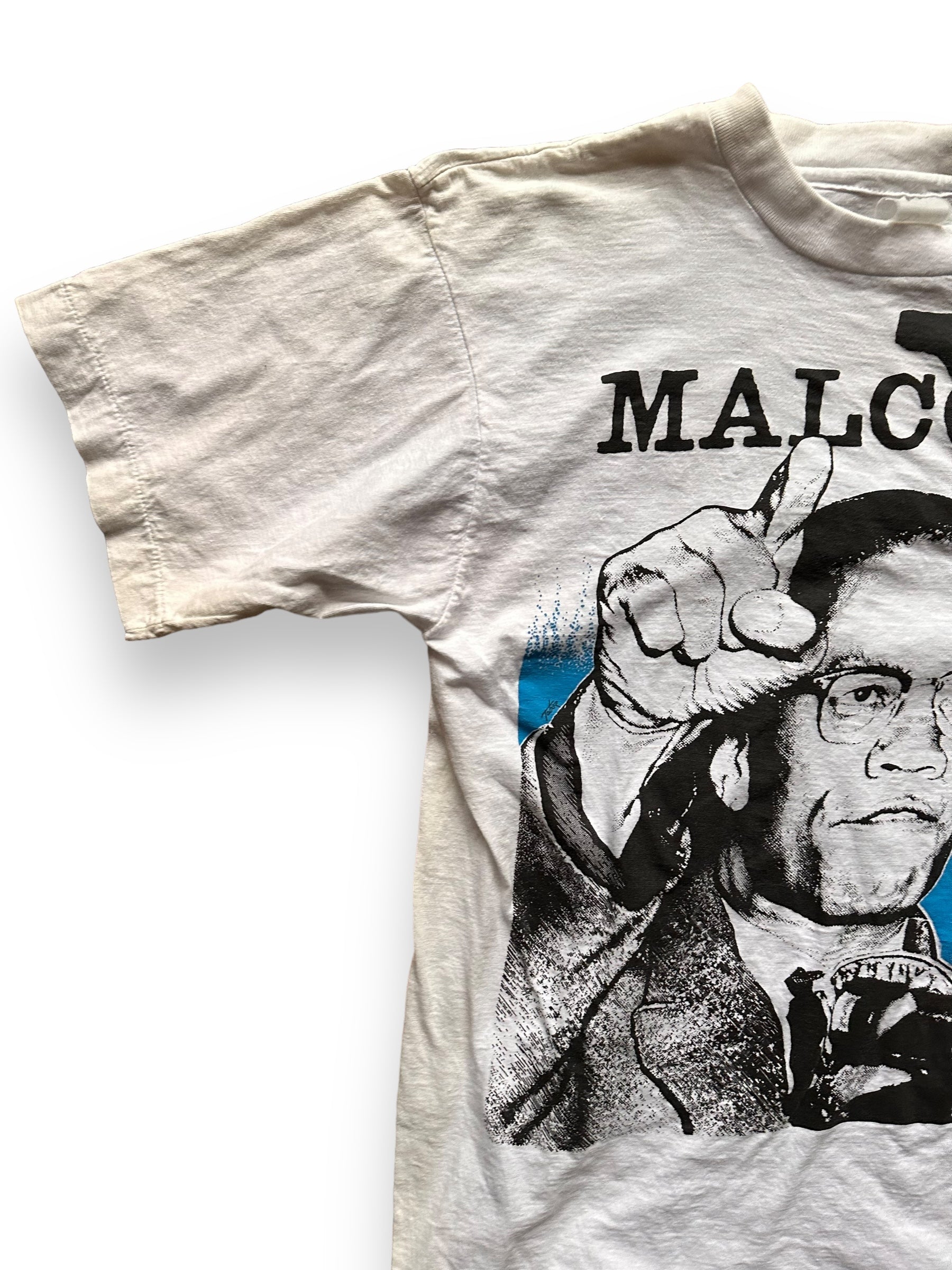 Front Left Shoulder View of Vintage 1991 Malcolm X Single Stitch Tee SZ M | Vintage Malcolm X T-Shirts Seattle | Barn Owl Vintage Clothing Seattle