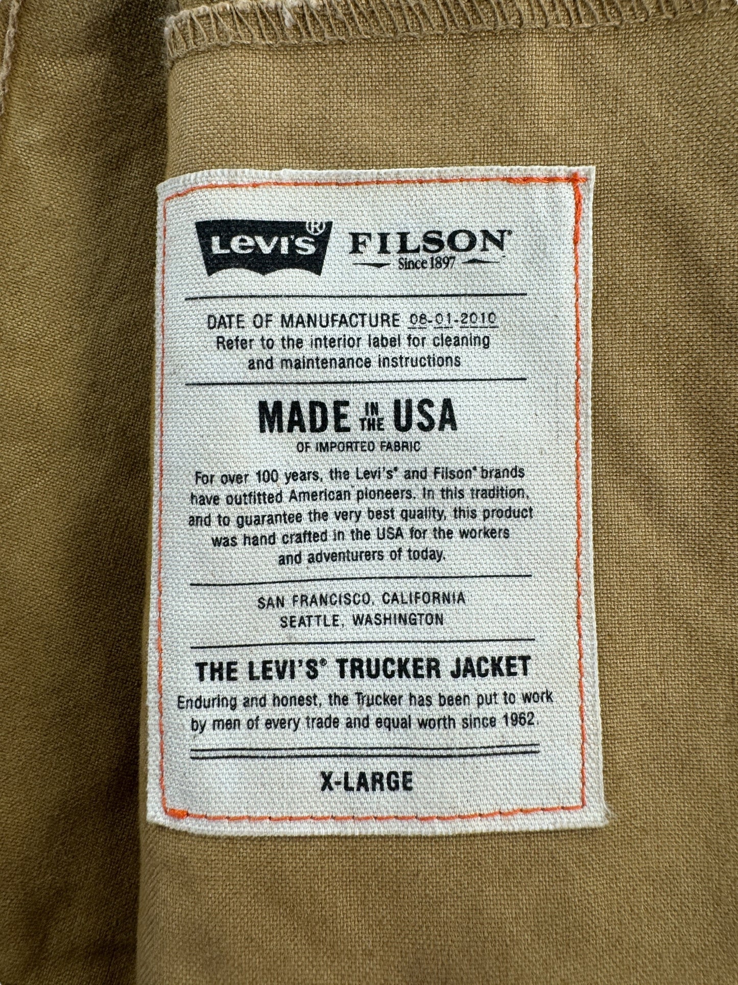 Label on Modern FIlson X Levis Tan Trucker Jacket SZ XL