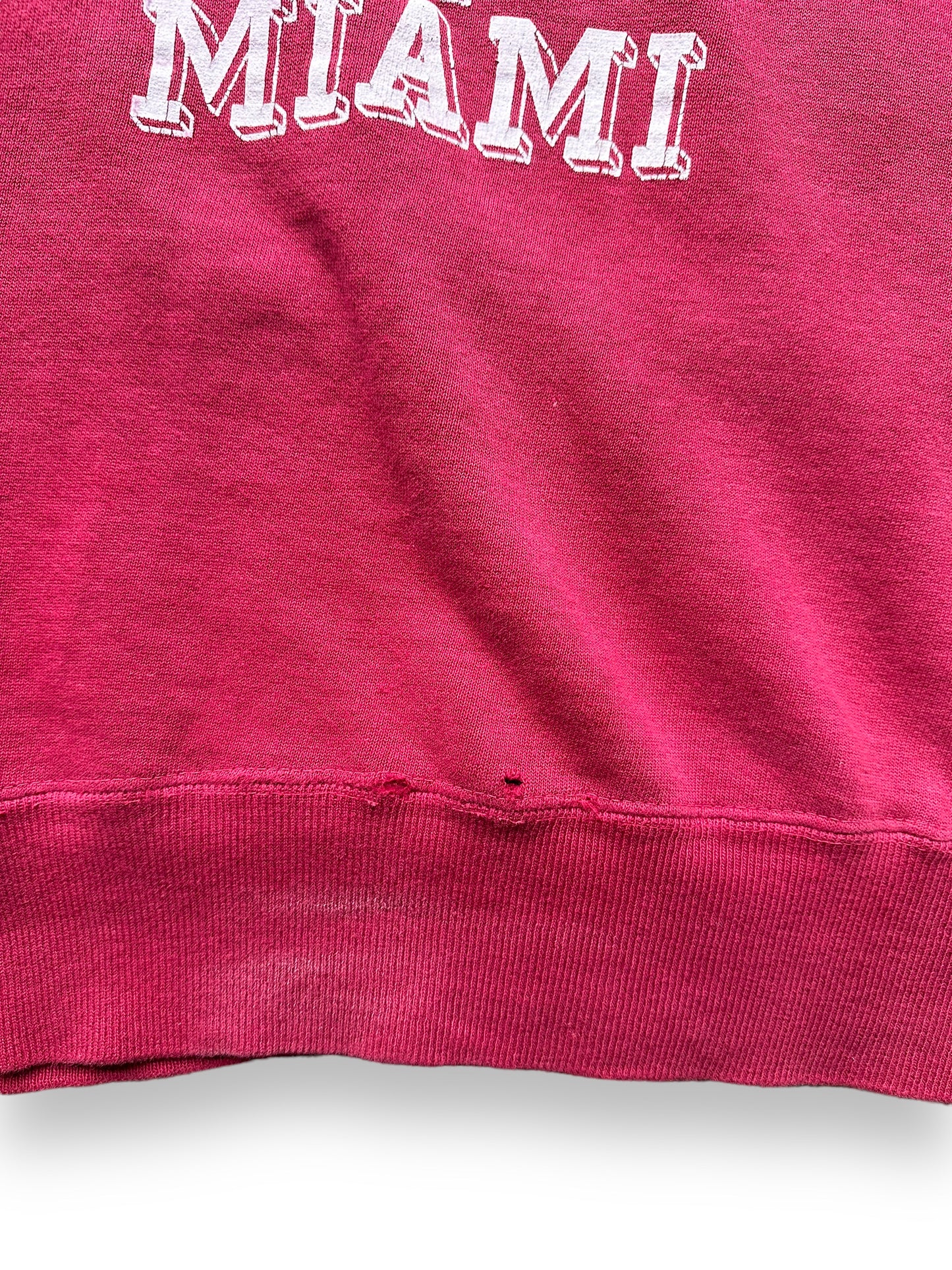 Small Hole and Wear towards hem on Vintage Two-Sided University of Miami Short Sleeve Crewneck Sweatshirt SZ M | Seattle Vintage Crewneck Sweatshirts | Barn Owl Vintage Seattle