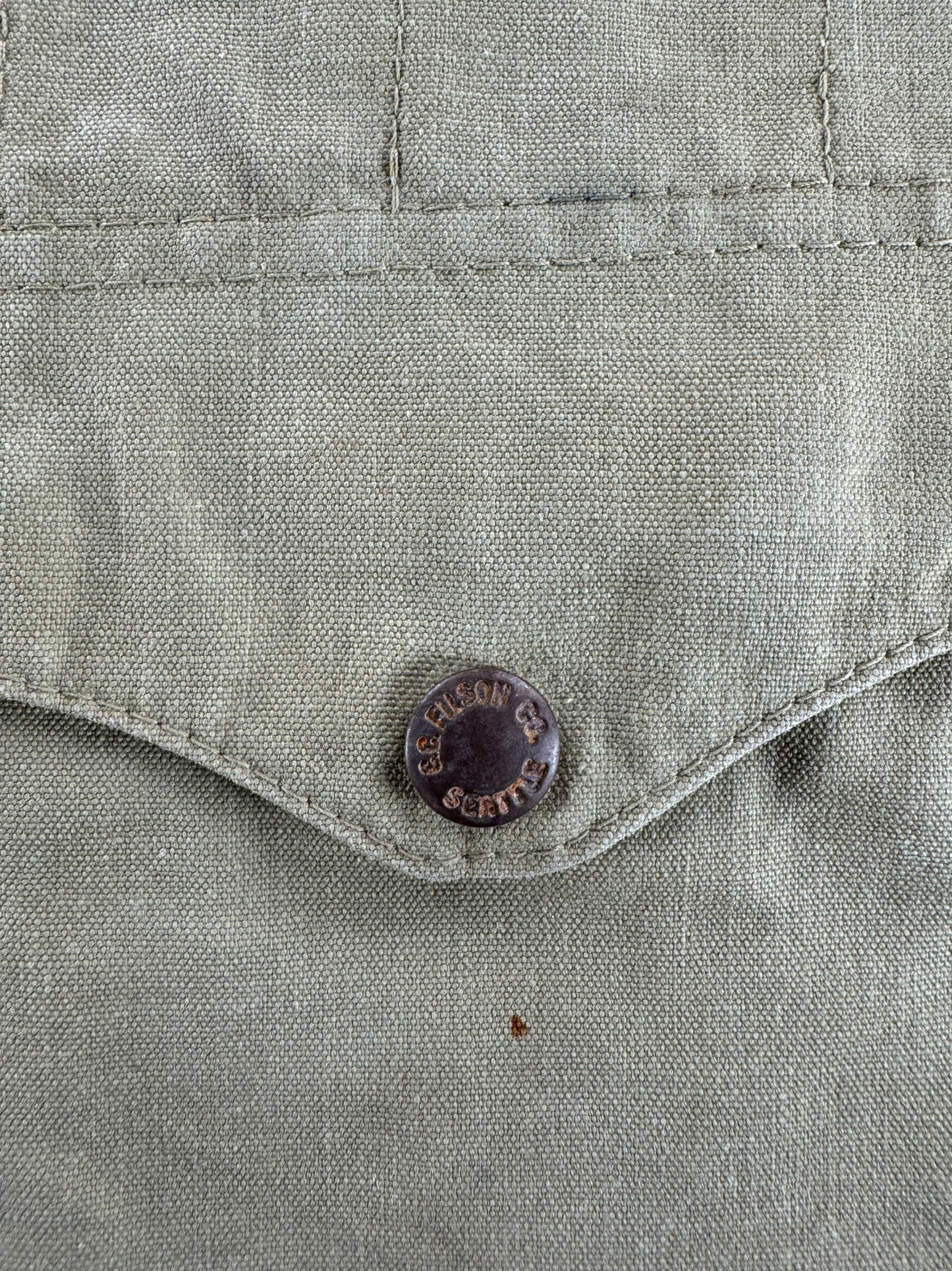Rusted Button on Vintage Filson Tin Cloth Vest SZ M