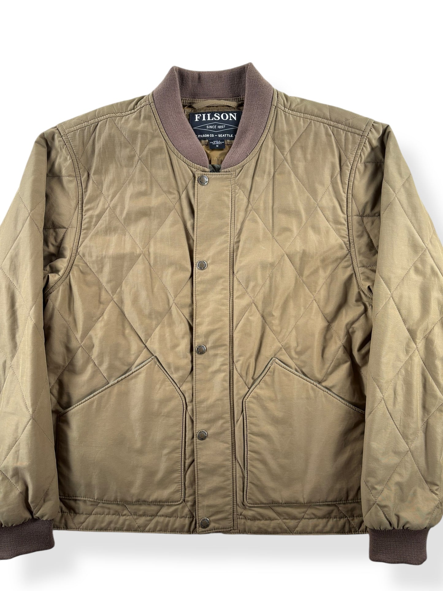 Front Close Up of Modern Filson Quilted Pack Bomber SZ M