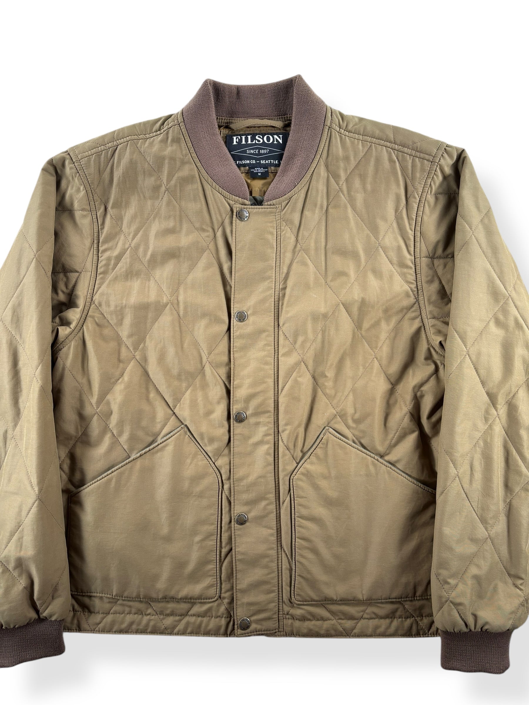 Front Close Up of Modern Filson Quilted Pack Bomber SZ M