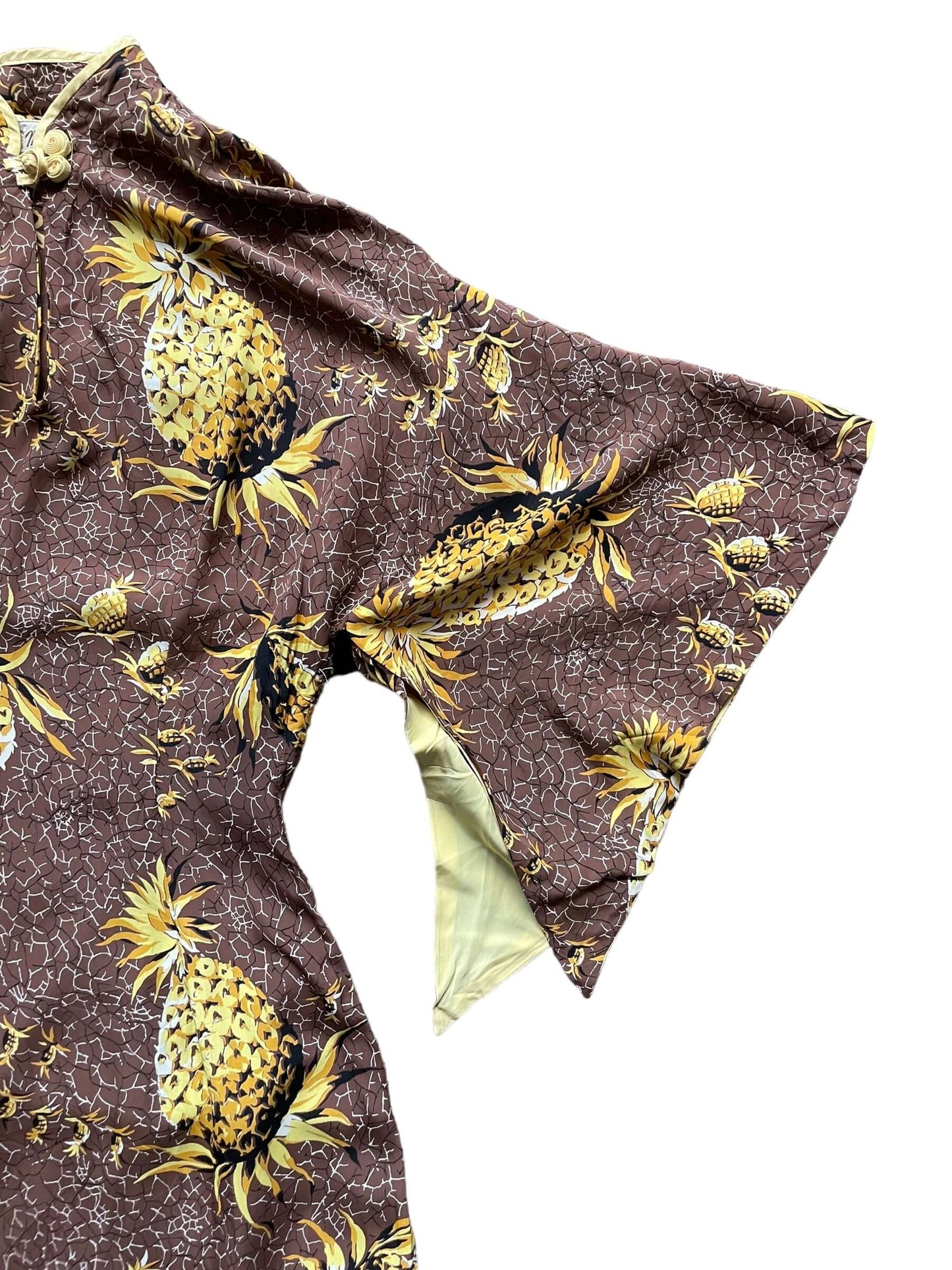 Front left sleeve view of 1940s Malihini Rayon Pineapple Dress XS-S