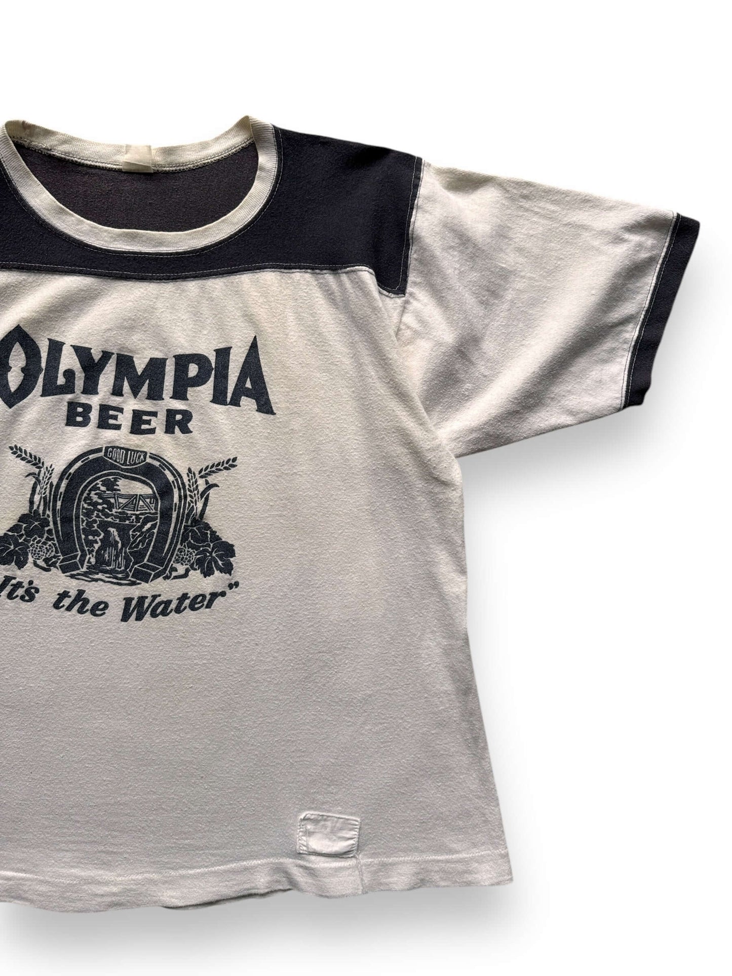 front left of Vintage Olympia Beer "It's The Water" Football Jersey SZ XL
