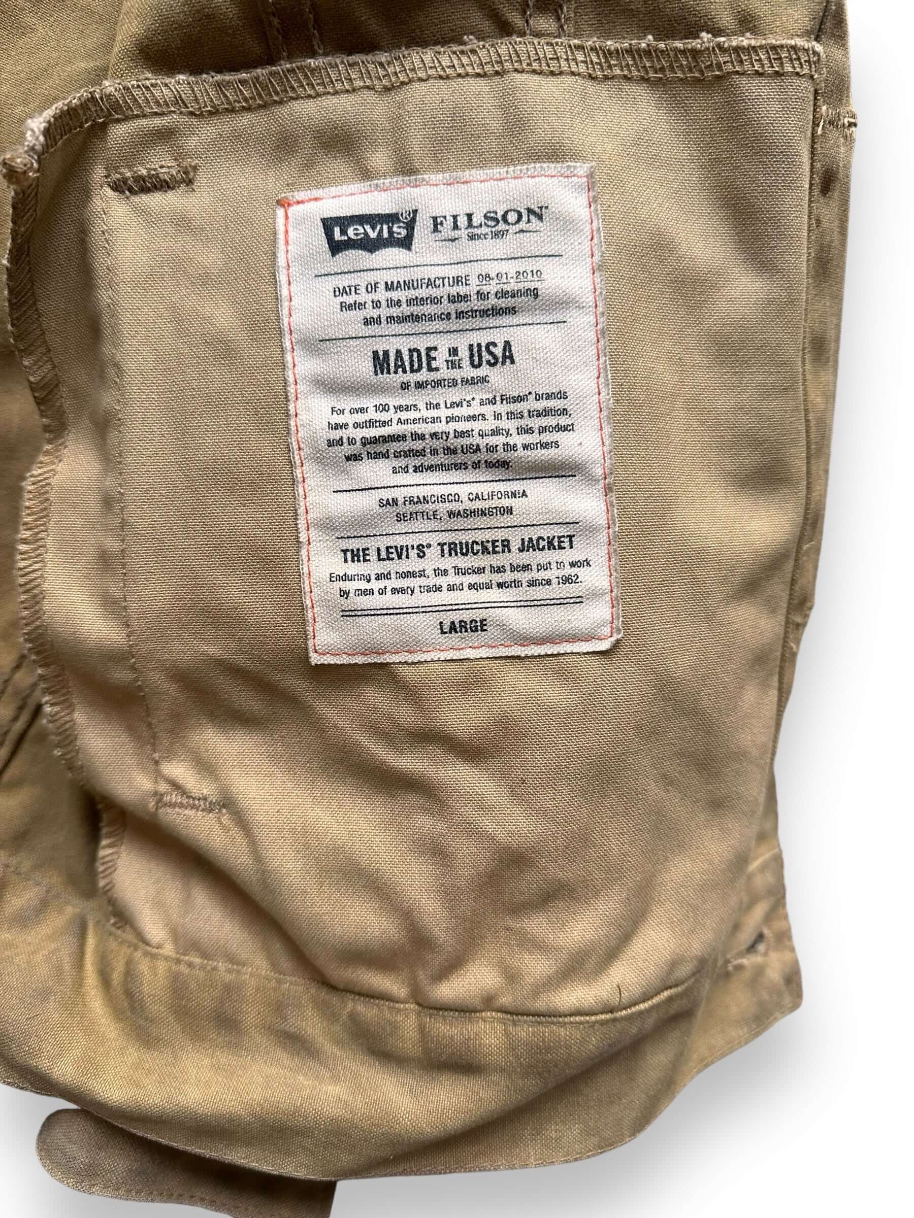 Levis X Filson Sizing Tag on Filson X Levis Tan Type III Trucker Jacket SZ Large |  Filson Levis Trucker Jacket