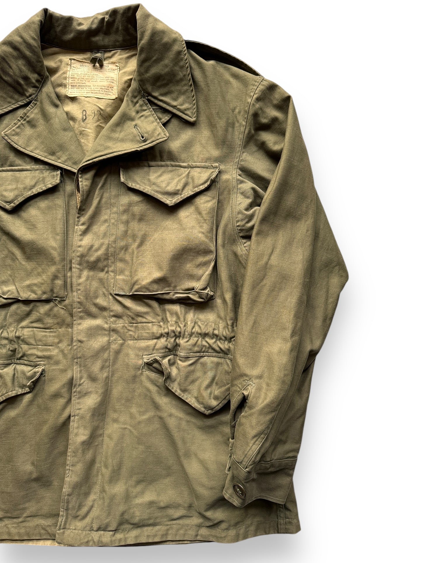 front left of Vintage WWII Era M-1943 Field Jacket SZ M