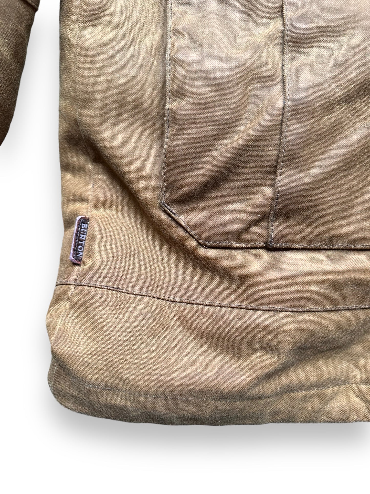 Burton Tag on Lower Right Side of Filson X Burton Sentry Snowboarding Jacket SZ L | Barn Owl Vintage Goods | Filson Workwear Seattle