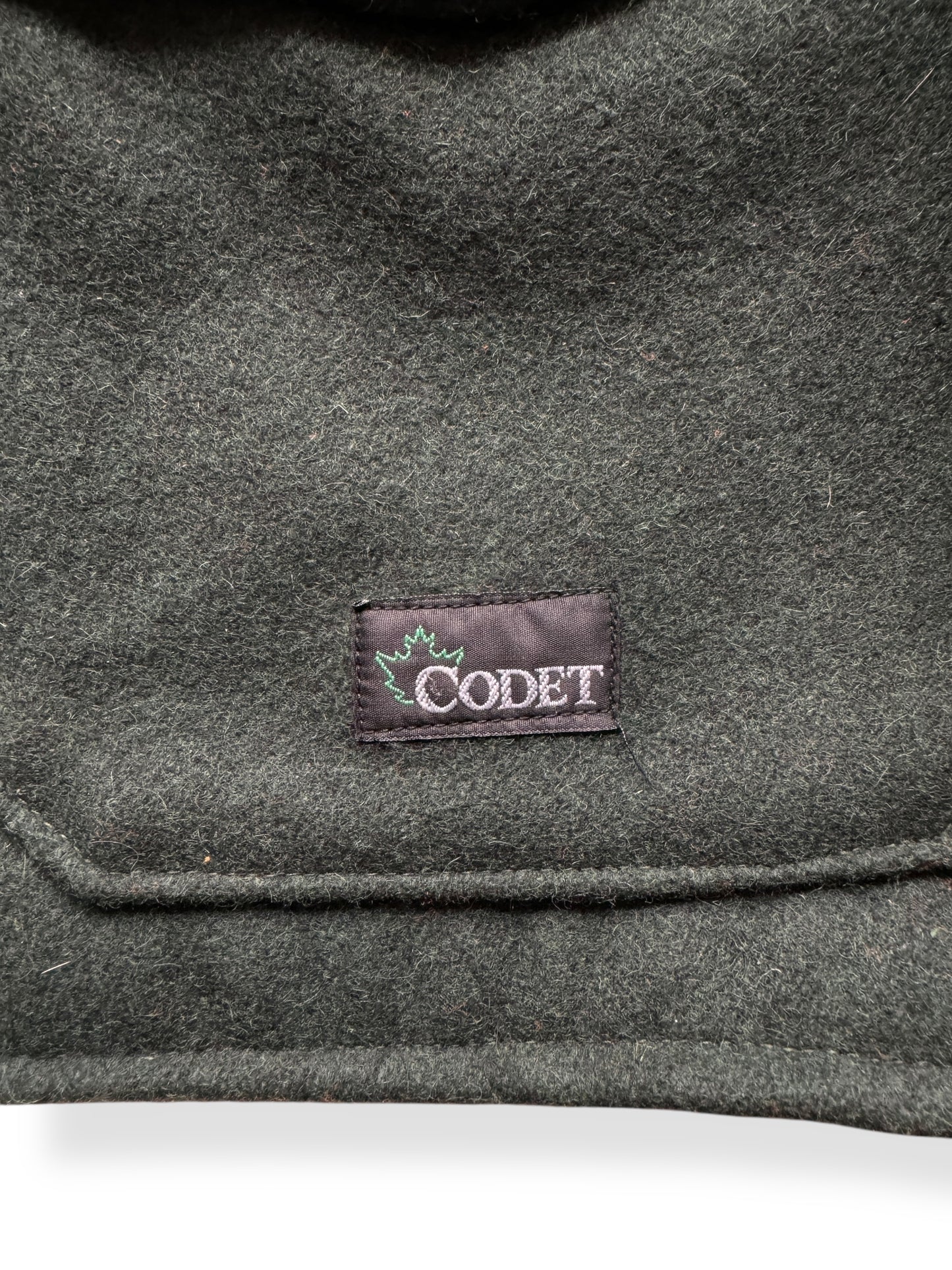 Label on Codet Green Wool Hunting Jacket SZ XL