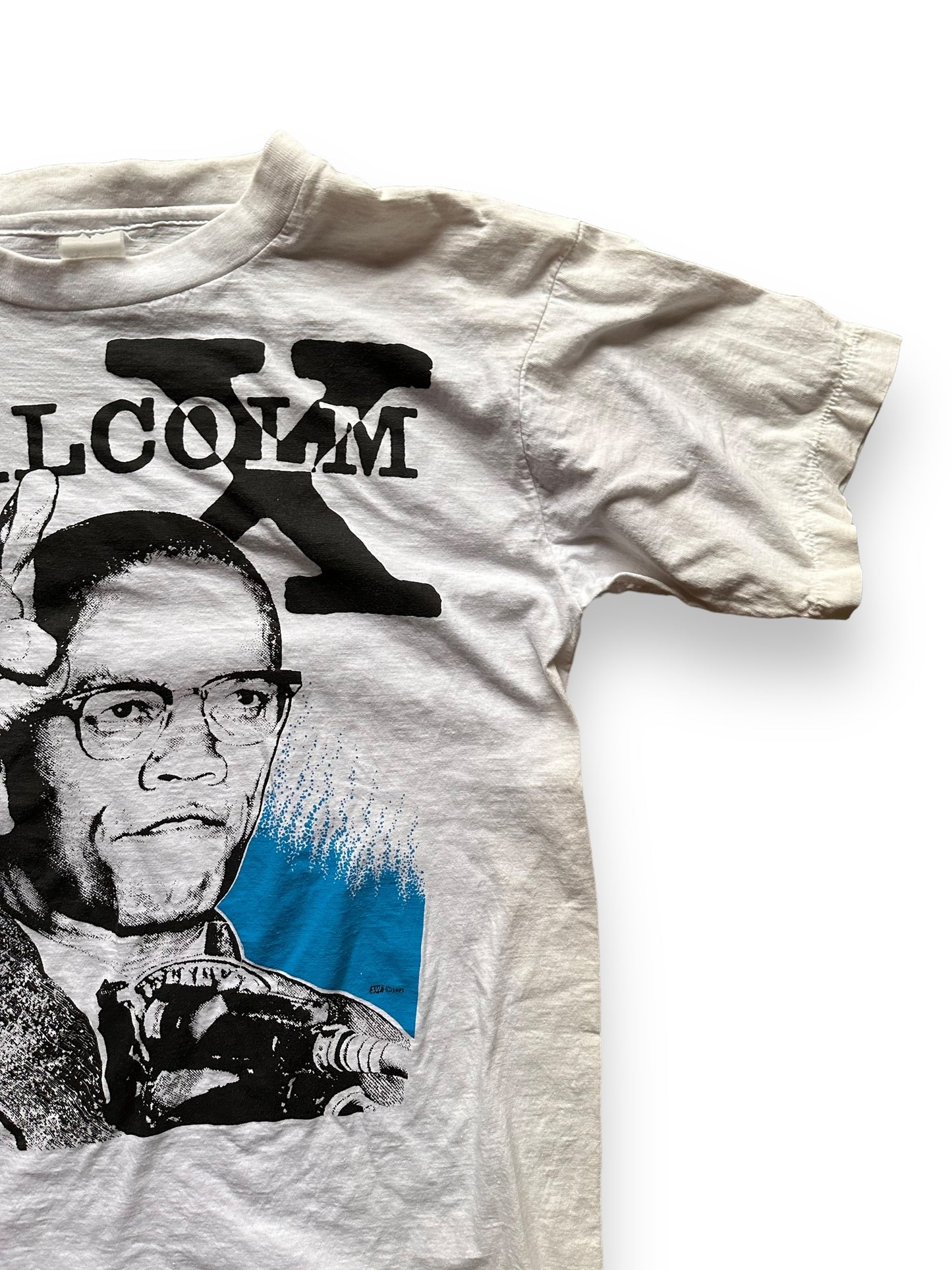 Front Right Shoulder View of Vintage 1991 Malcolm X Single Stitch Tee SZ M | Vintage Malcolm X T-Shirts Seattle | Barn Owl Vintage Clothing Seattle