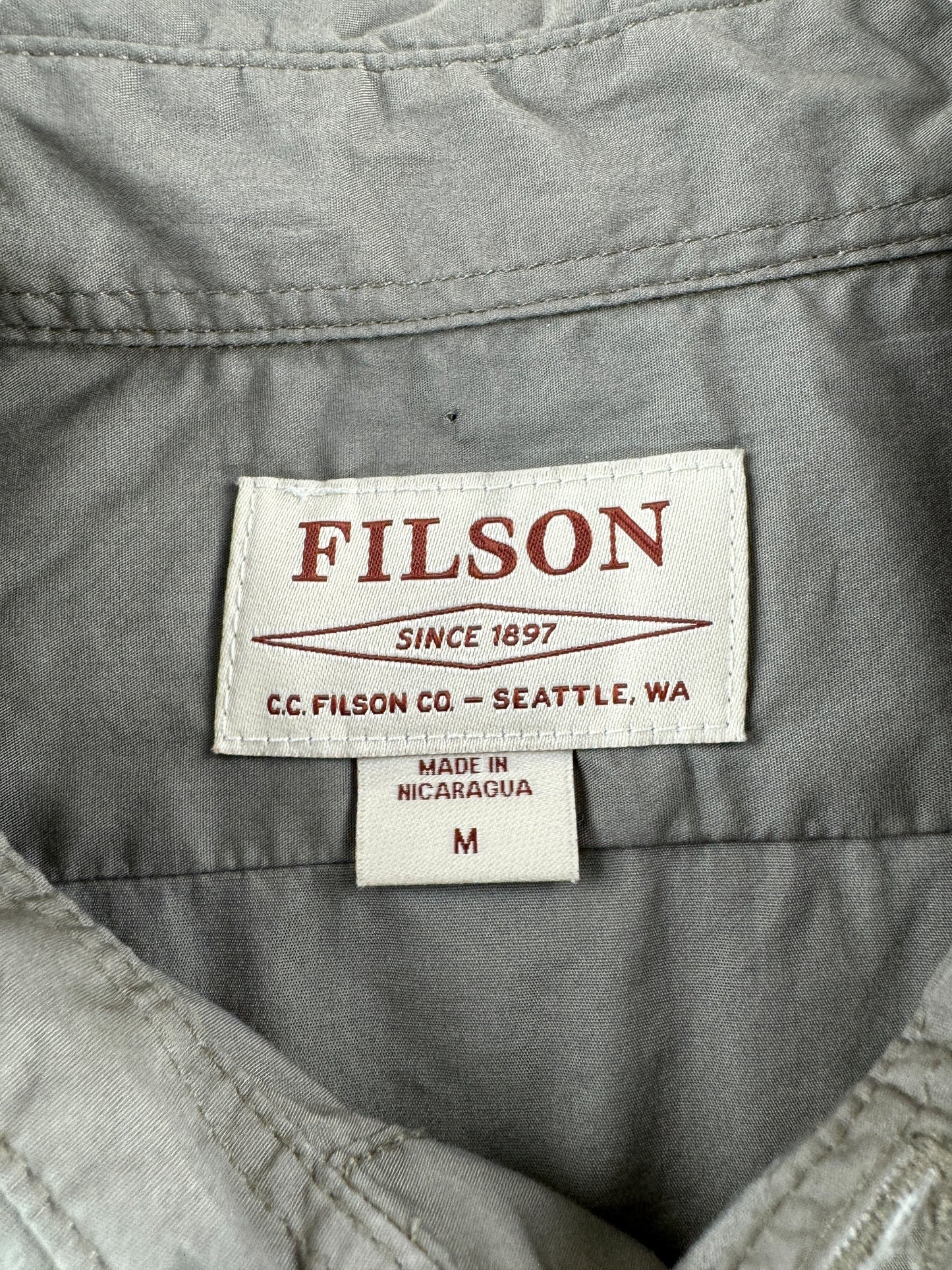 Tag on Filson Light Olive Left Handed Light Shooting Shirt SZ M