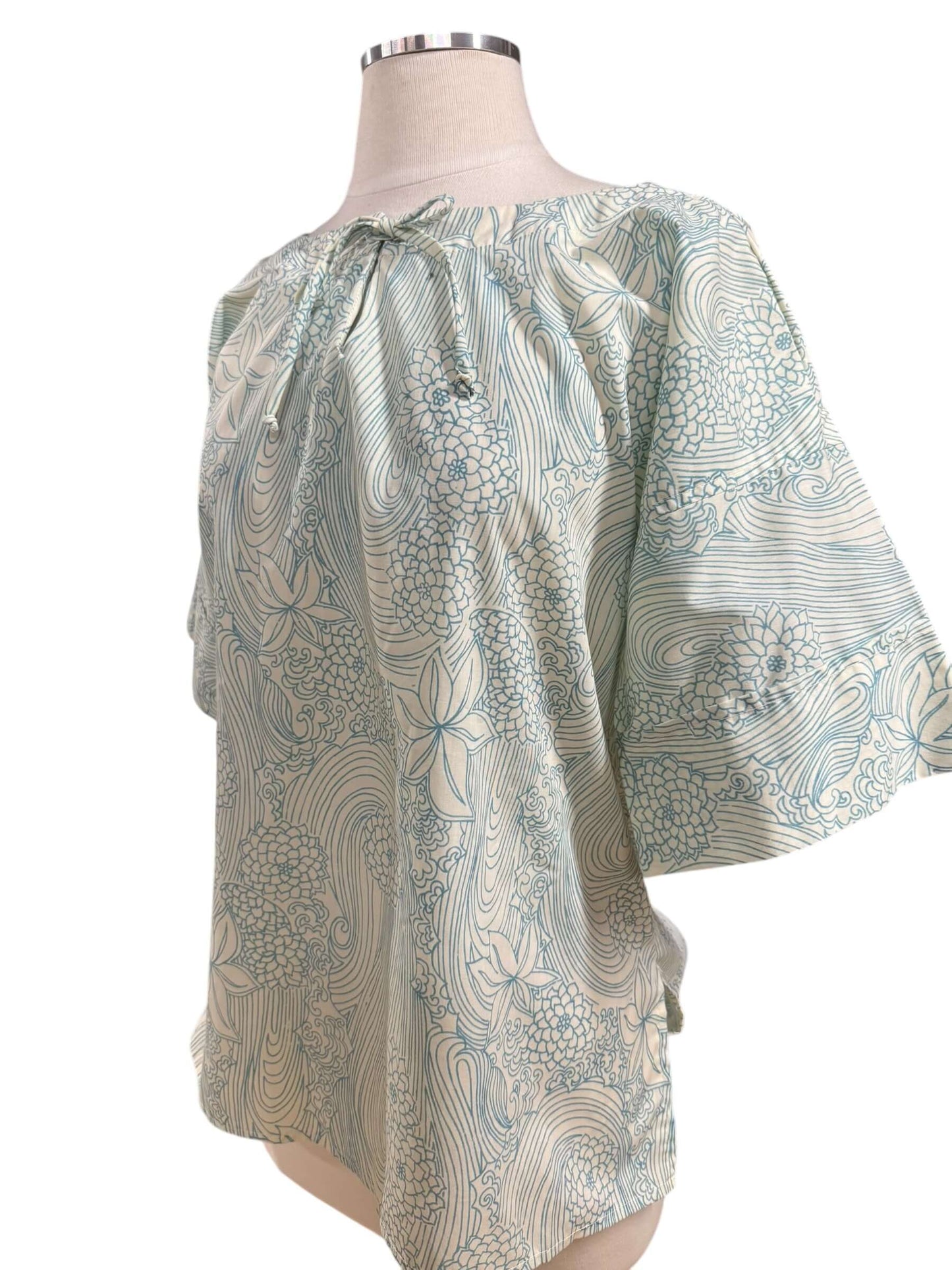 Side view of 1960s Ruth's Blue Floral Top L