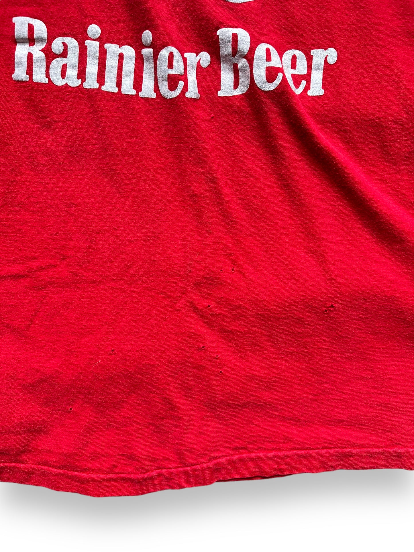 Small Pinholes on Front of Vintage Rainier Beer Tee SZ L | Vintage Beer T-Shirts Seattle | Barn Owl Vintage Tees Seattle