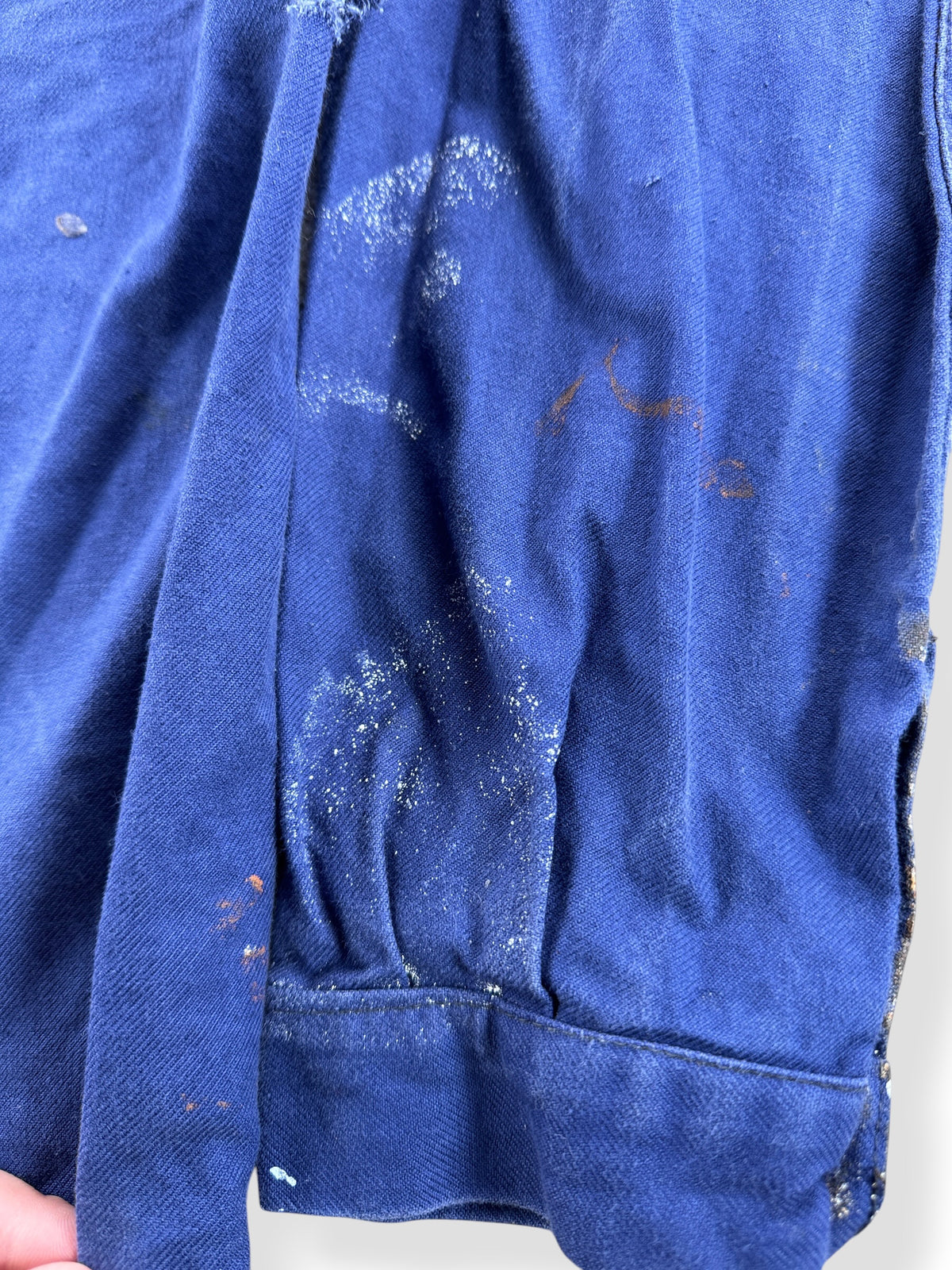 Paint on back sleeve of Vintage Paint Splattered French Chore Coat SZ M
