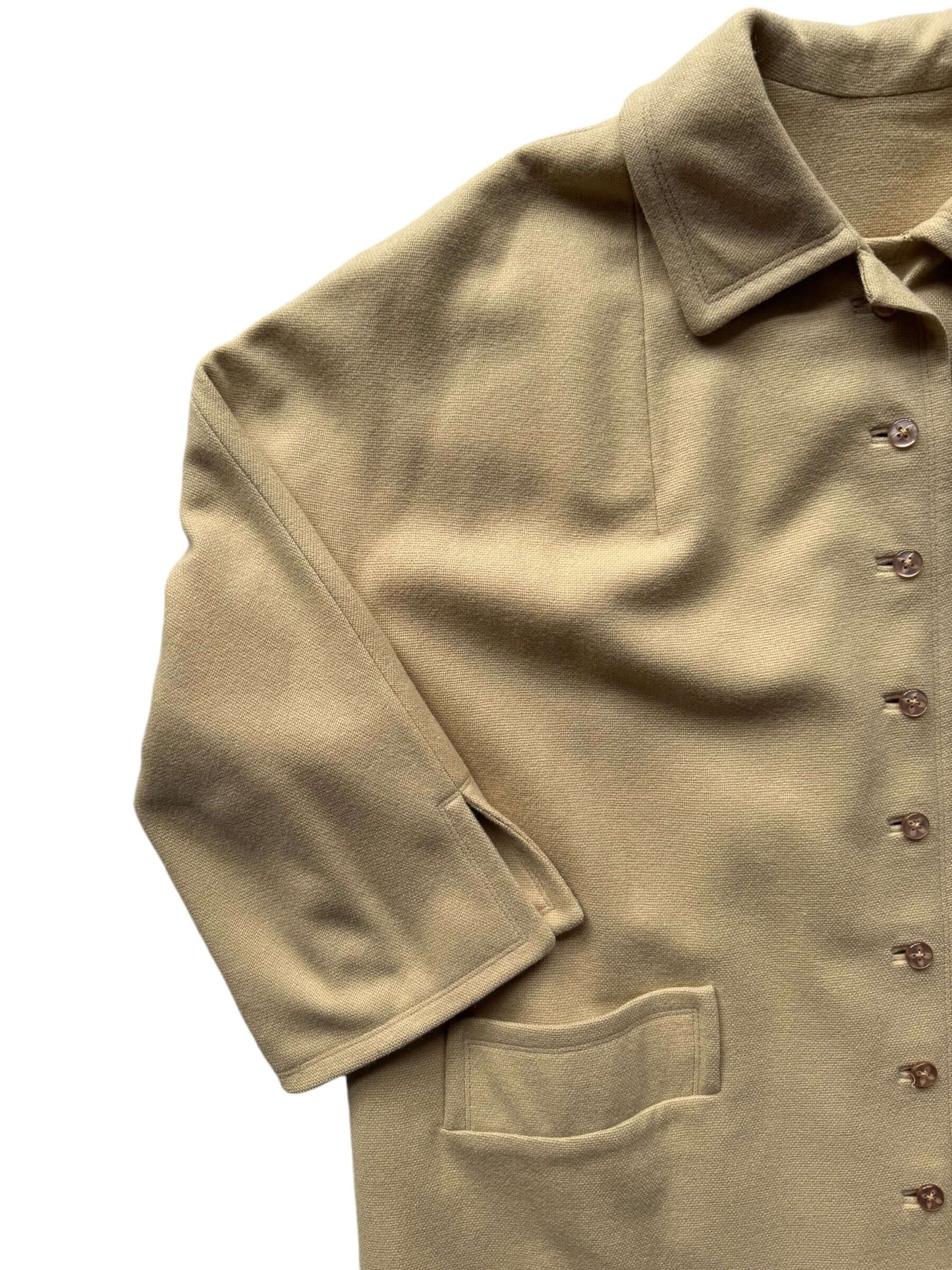 Front right shoulder view of 1960s 'The Travelaire' Beige Wool Coat M-XL