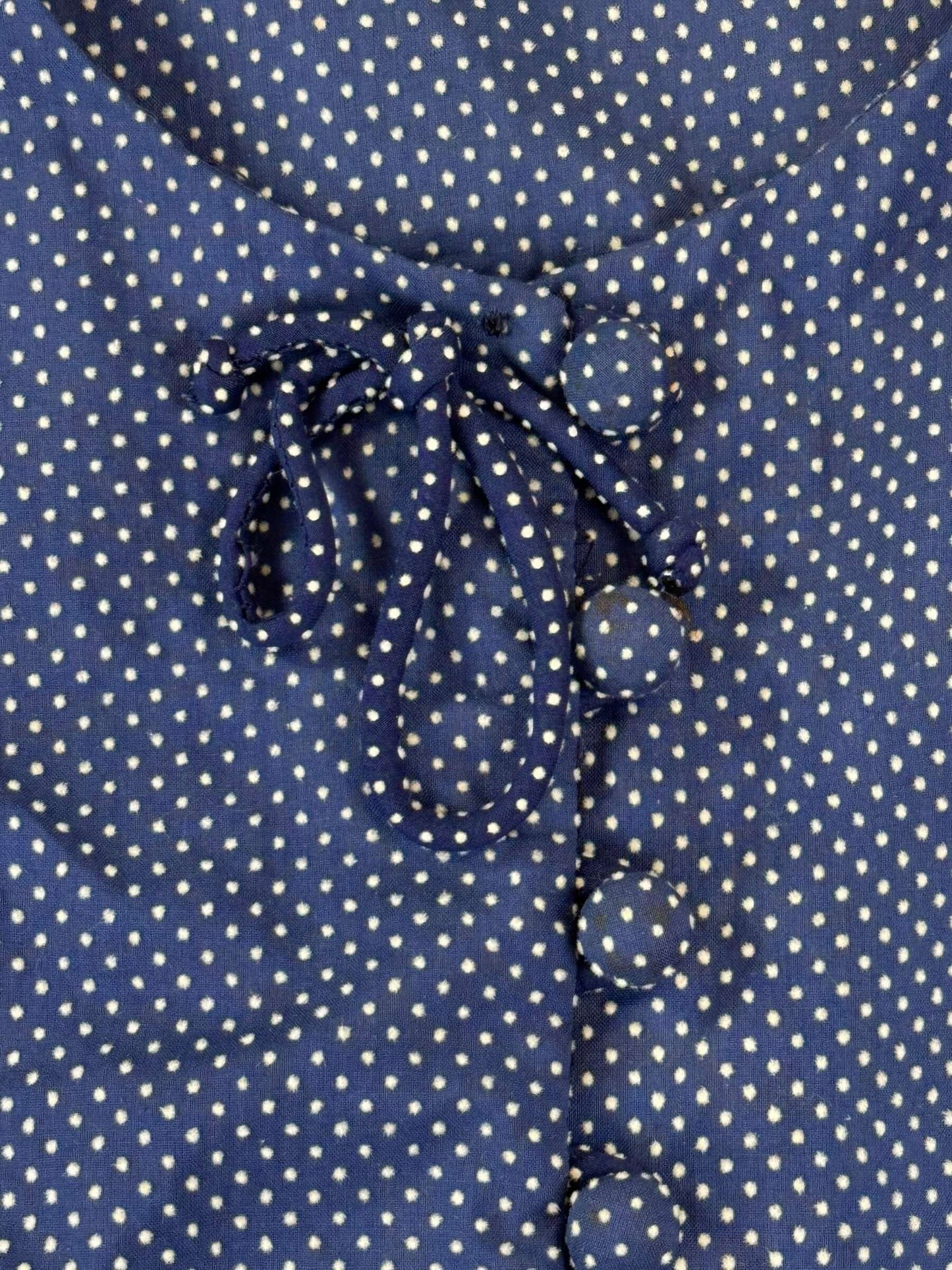 Button close up of 1950s Navy Blue Swiss Dot Set S
