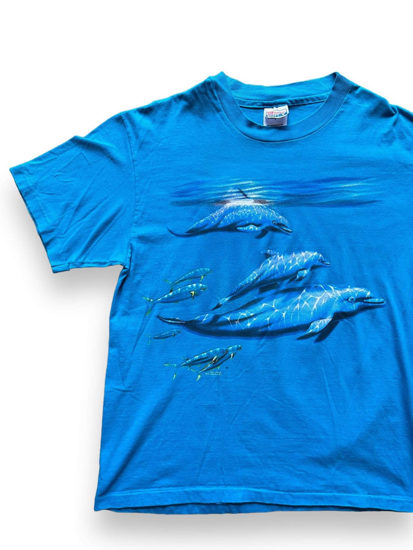 front right of Vintage Cape Cod AOP Dolphin Tee SZ L
