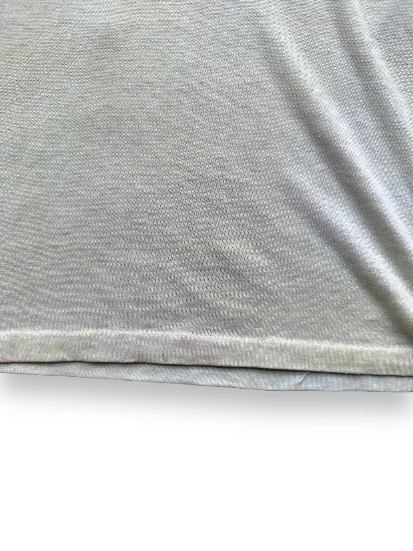Slight staining on rear hem of Vintage Elite Tavern Seattle Tee SZ S | Vintage Single Stitch T-Shirts Seattle | Barn Owl Vintage Tees Seattle