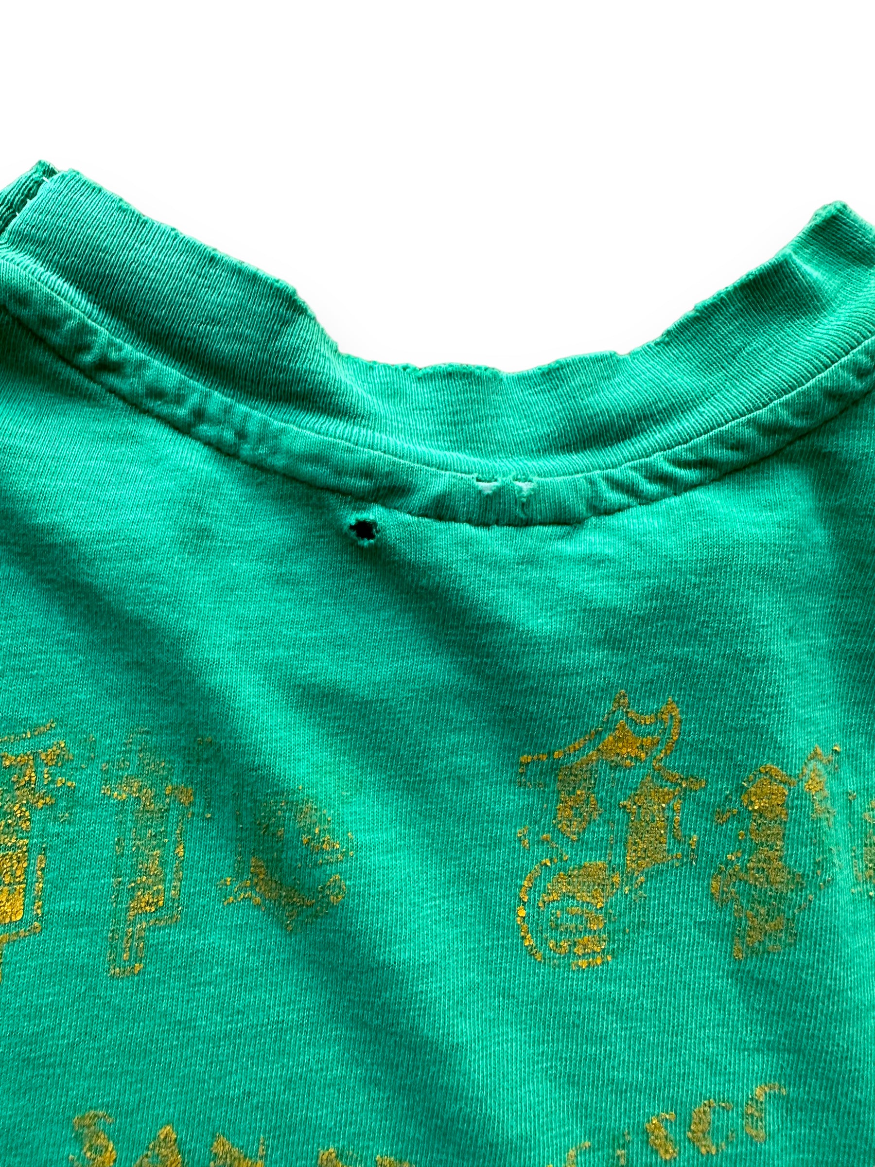 Back distressing around neck of Vintage Distressed Seafood Restaurant Tee SZ M |  Vintage Fishing Tee Seattle | Barn Owl Vintage