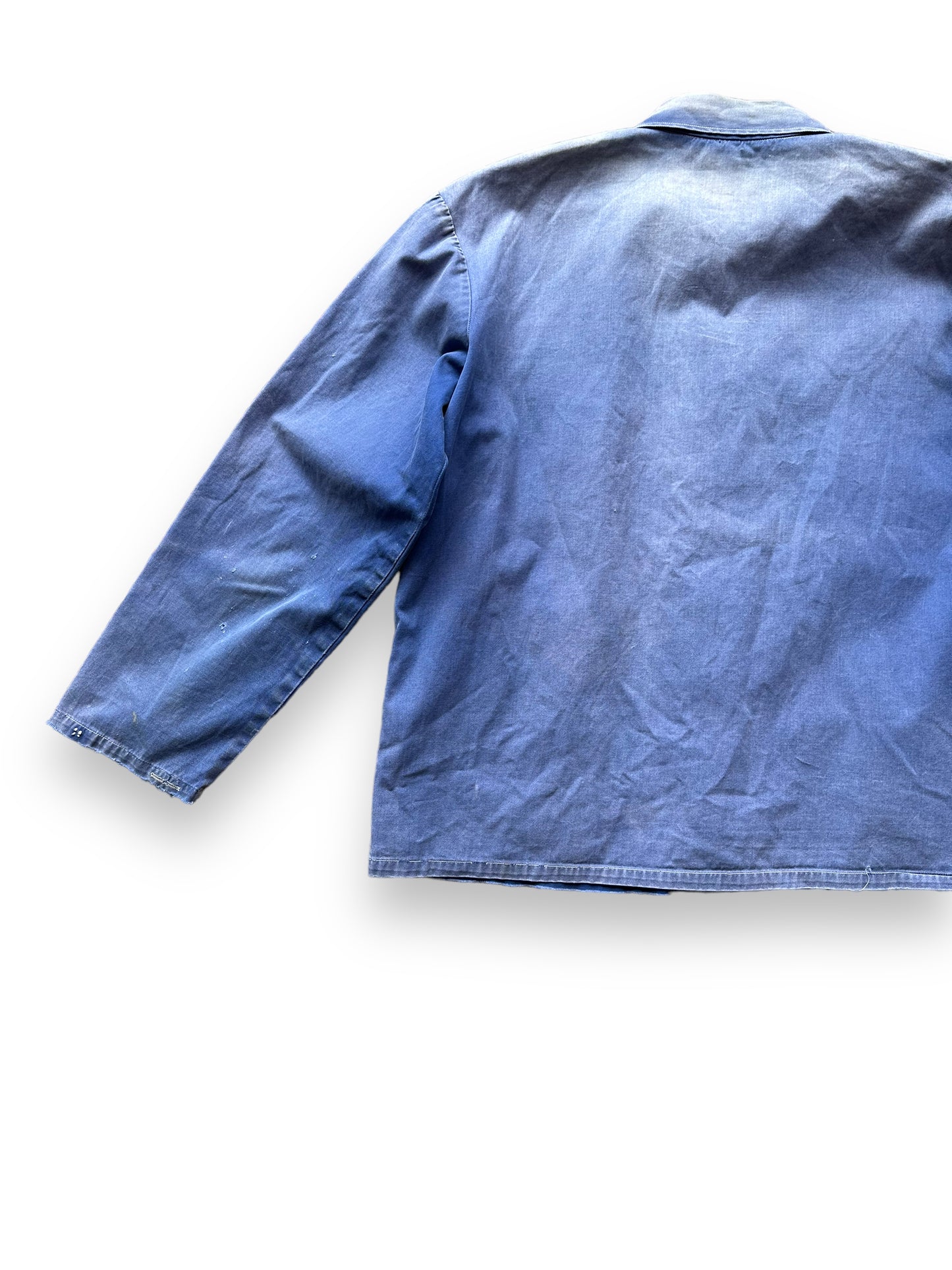 Rear Left View of Vintage Faded French Workwear Chore Coat SZ L | Vintage European Workwear Seattle | Barn Owl Vintage Goods Seattle