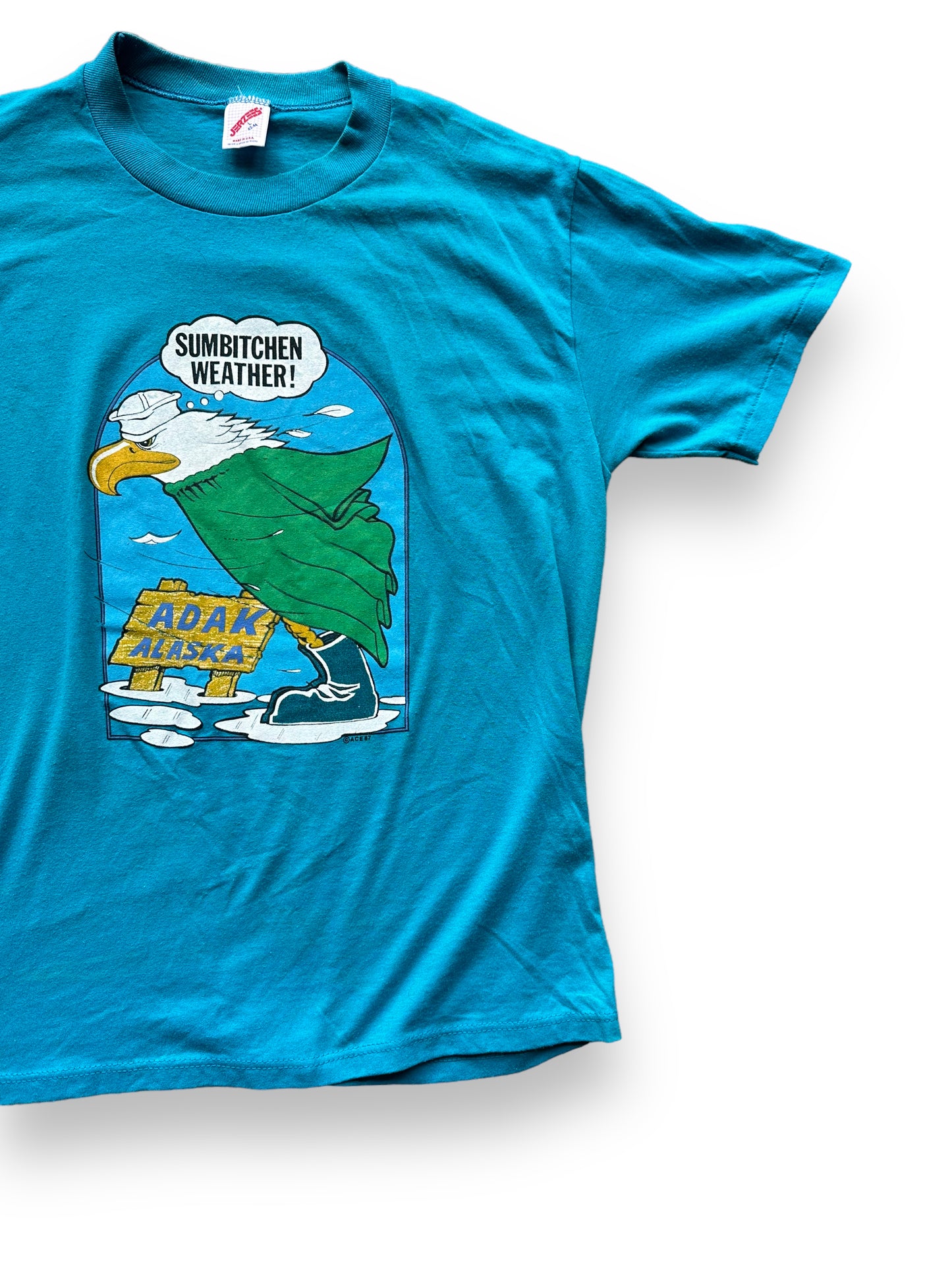 Front Left View of Vintage Sumbitchen Weather Adak Alaska Tee SZ L | Vintage Single Stitch Alaska T-Shirts Seattle | Barn Owl Vintage Tees Seattle