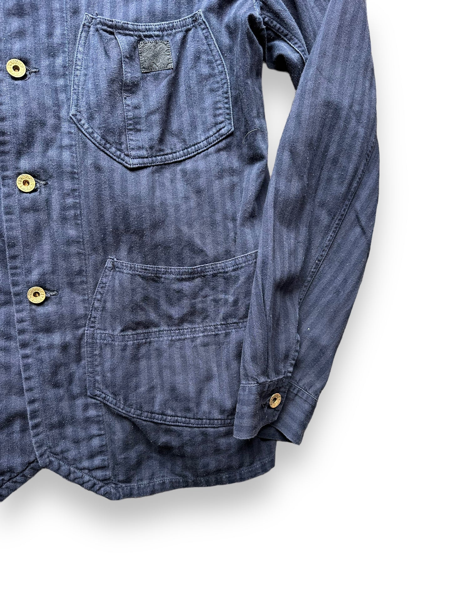 Lower Front Left View of Sugarcane Reproduction Herringbone Twill Chore Coat SZ L | Vintage European Workwear Seattle | Barn Owl Vintage Goods Seattle
