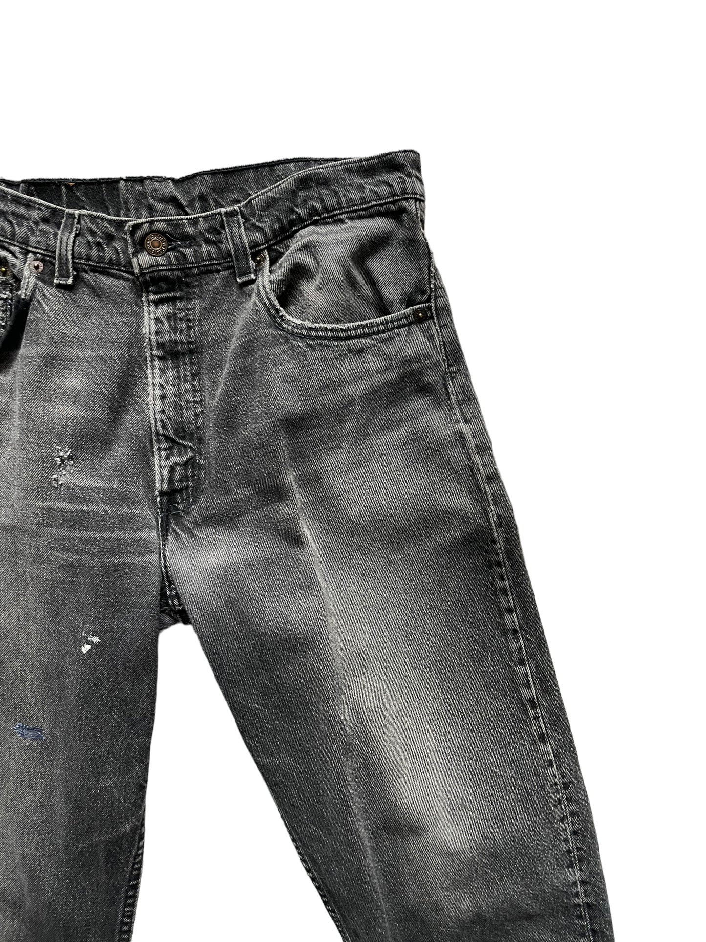 Upper front left side view of Vintage USA Mended Black Levi's 550s 33x34