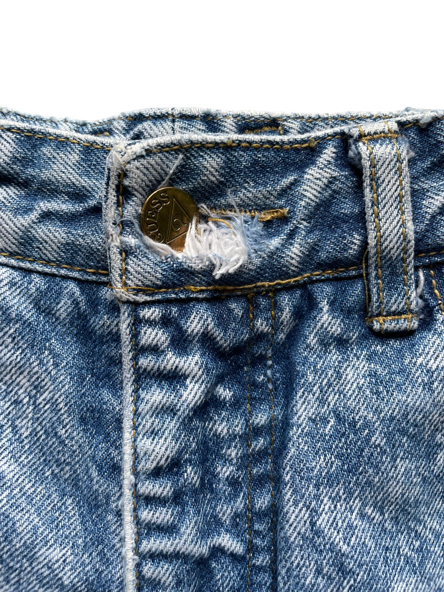 Button hole fray detail of Vintage 80s Ankle Zip Acid Wash Guess Jeans