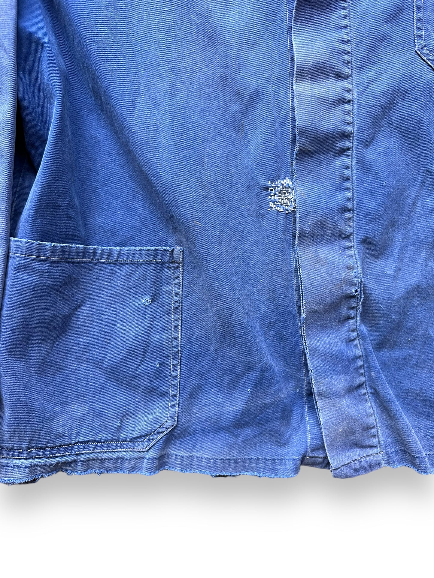 Lower Front Portion with Hand Repairs on Vintage Faded French Workwear Chore Coat SZ L | Vintage European Workwear Seattle | Barn Owl Vintage Goods Seattle