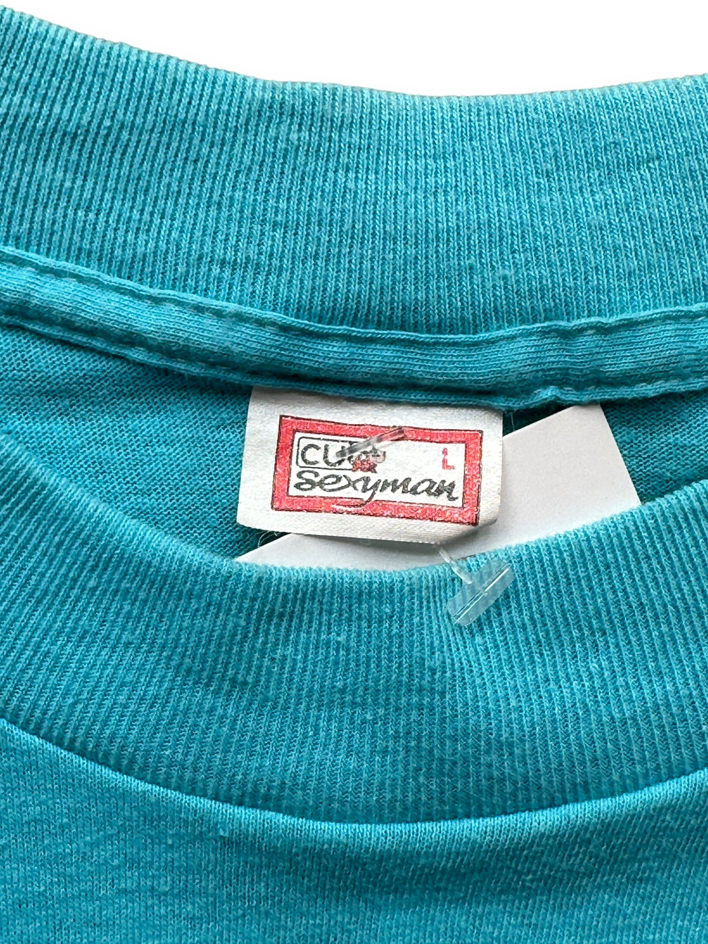 Tag close up shot of Vintage Blue Santo Domingo Graphic Tee SZ L | Vintage T-Shirts Seattle | Barn Owl Vintage Tees Seattle