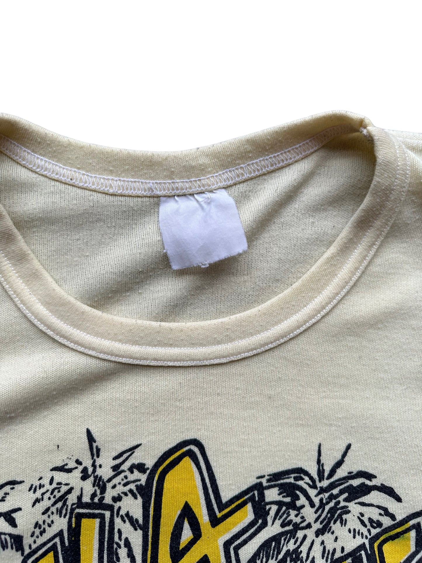 Faded Tag View of Vintage Bula Fiji Yellow Graphic Tee SZ L | Vintage T-Shirts Seattle | Barn Owl Vintage Tees Seattle