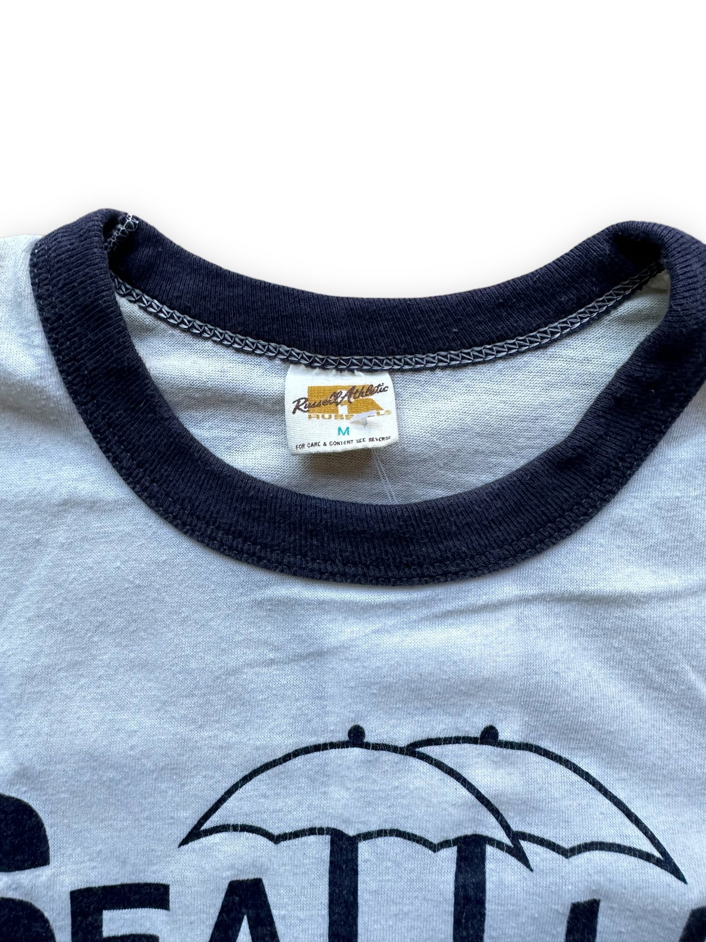 Tag Close Up on Vintage Seattle City of Wet Dreams Ringer Tee SZ M | Vintage Russell Athletic T Shirt | Barn Owl Vintage Seattle