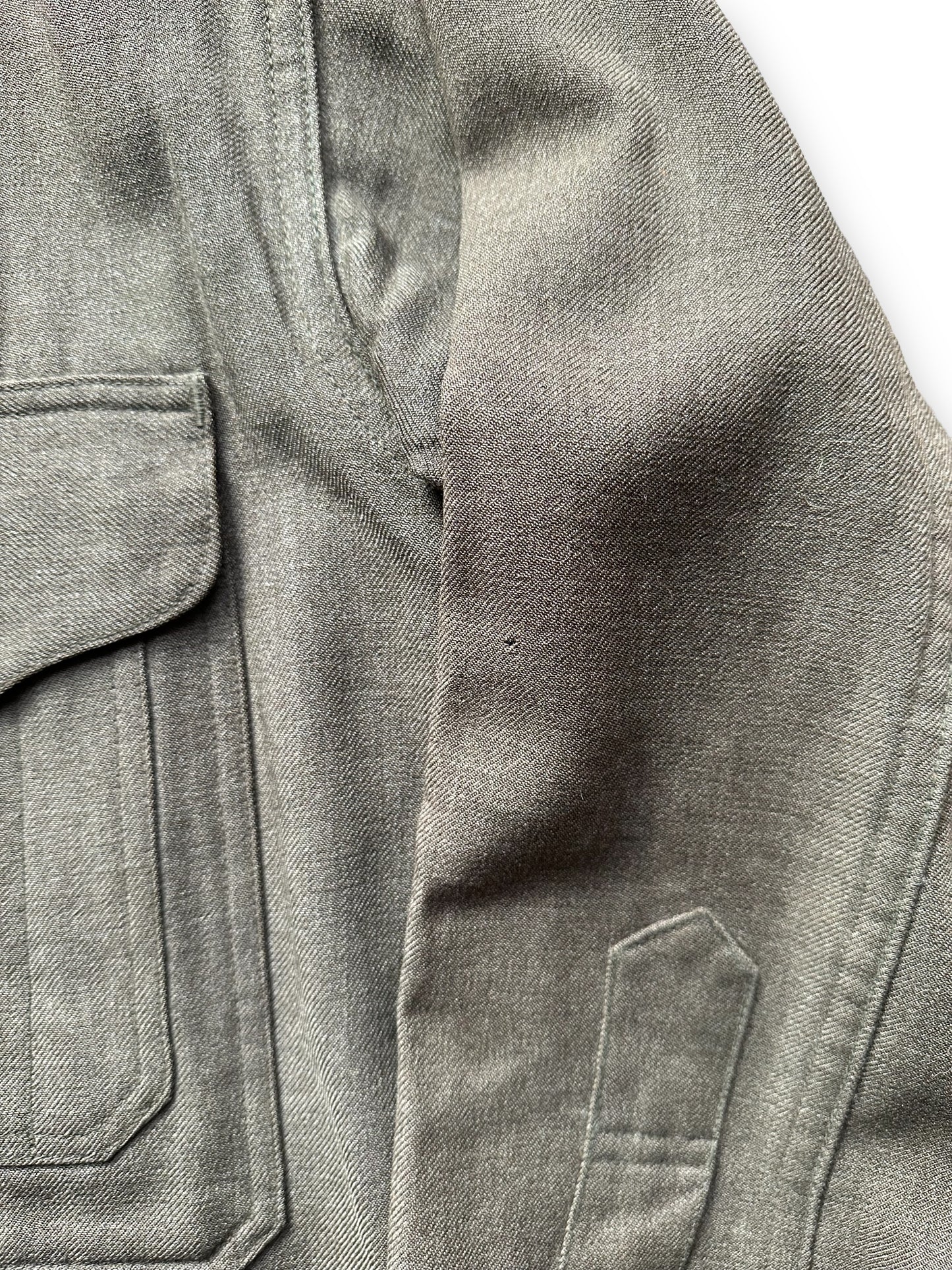Small Hole on Left Sleeve on Vintage Union Made Era 50s Filson Forestry Cloth Cruiser SZ 44 | Barn Owl Vintage Goods | Vintage Workwear Seattle