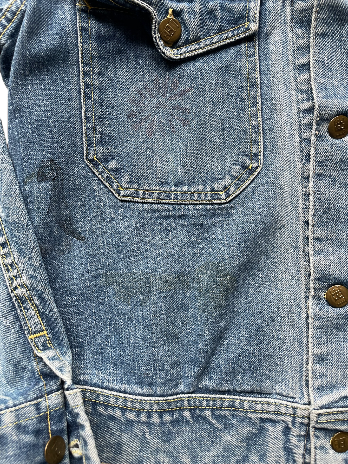 vintage lee jacket close up of faded drawing. seattle true vintage. barn owl vintage.