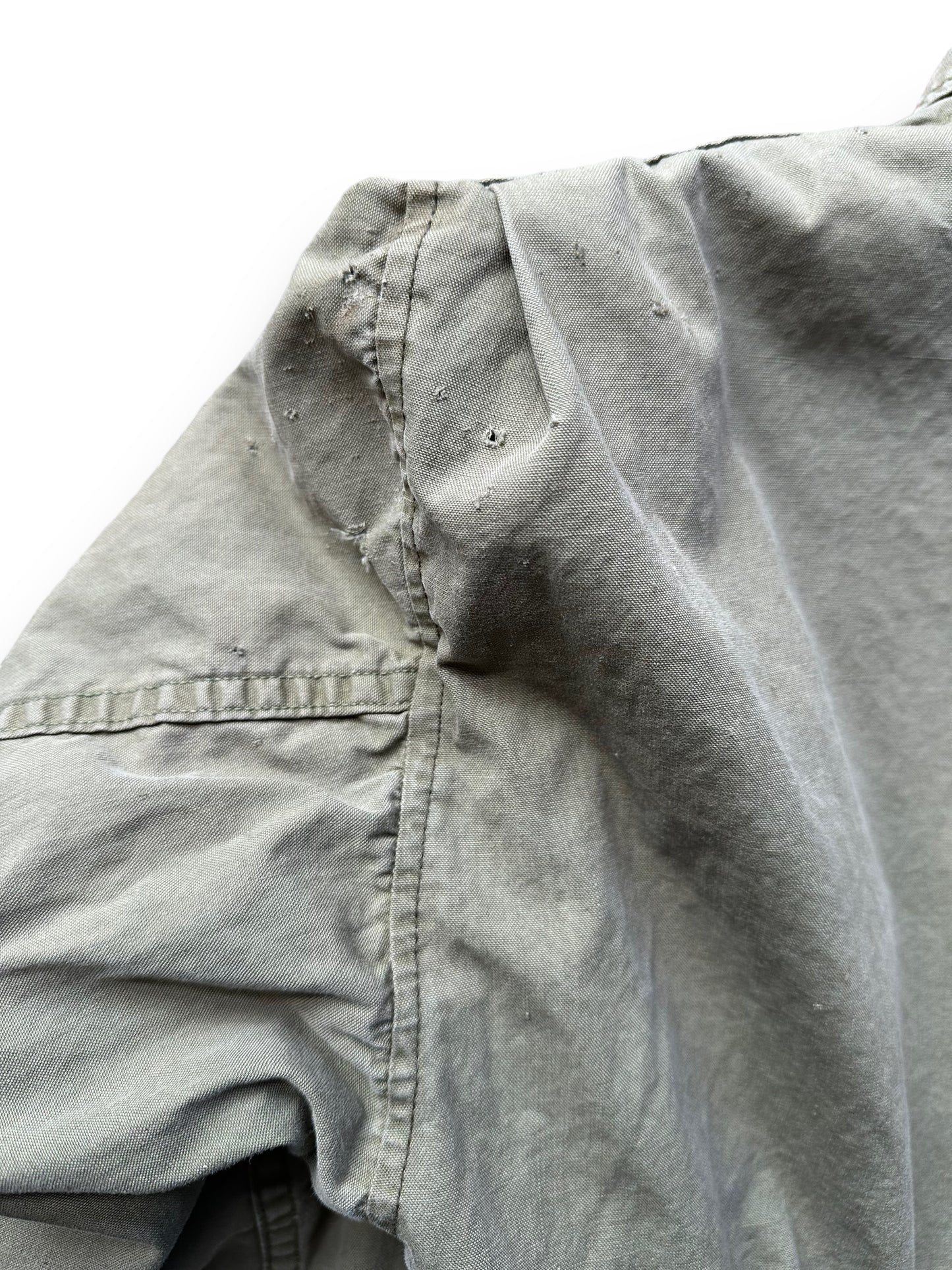 Holes in Left Rear Shoulder of Vintage WWII USN M-41 Field Jacket SZ M | Seattle Vintage Military Gear | Barn Owl Vintage Clothing Seattle