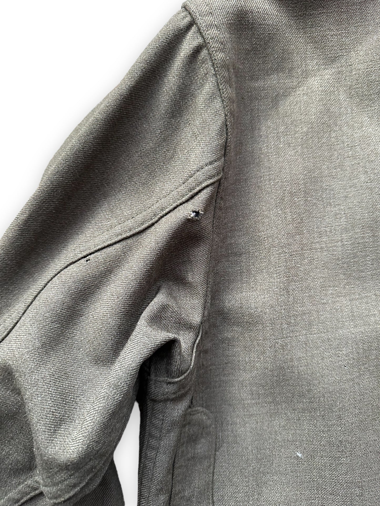 Small Hole on Back of Left Sleeve on Vintage Union Made Era 50s Filson Forestry Cloth Cruiser SZ 44 | Barn Owl Vintage Goods | Vintage Workwear Seattle