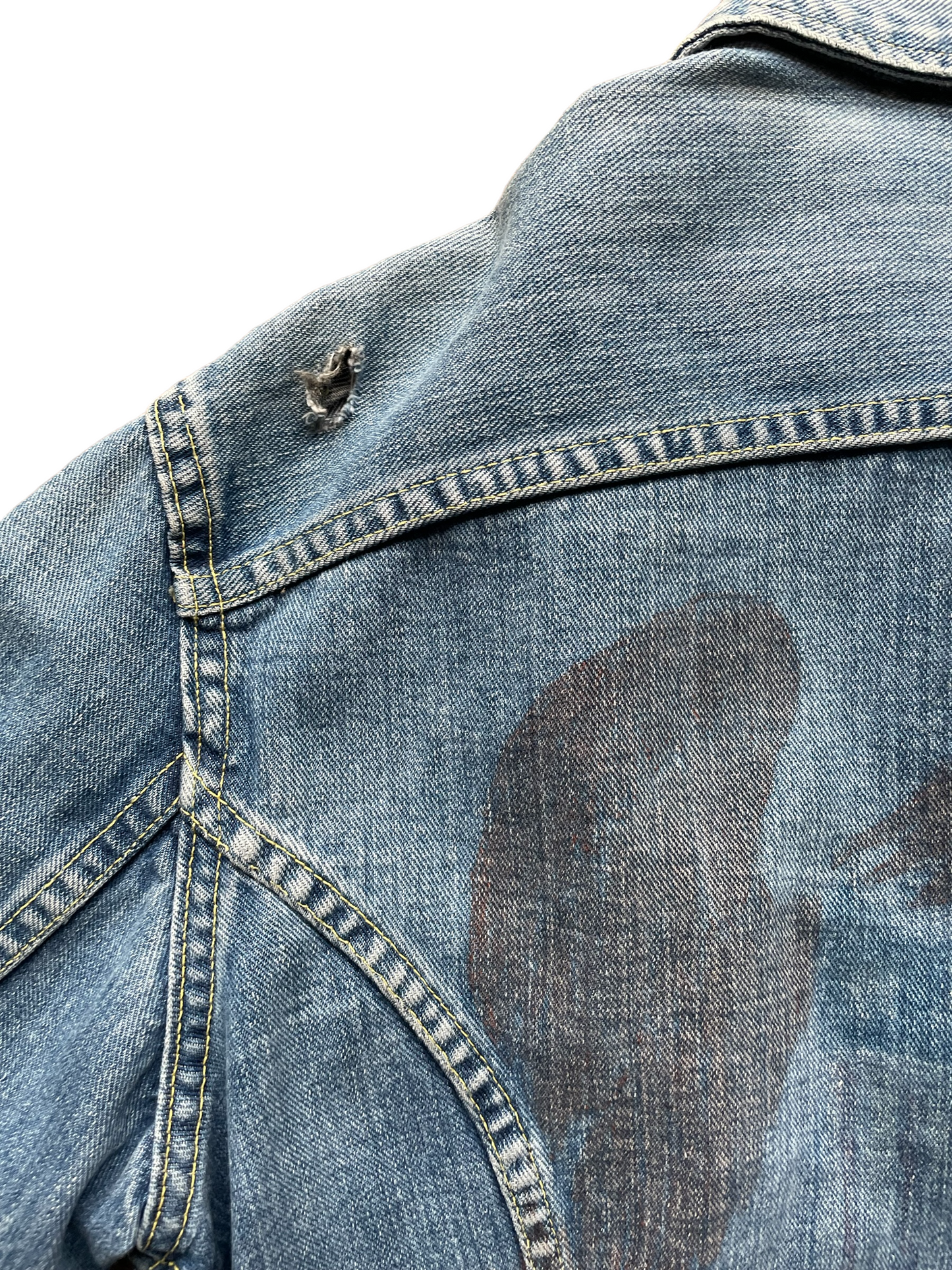 Small hole on Vintage Lee Jacket. Seattle Vintage Clothing.