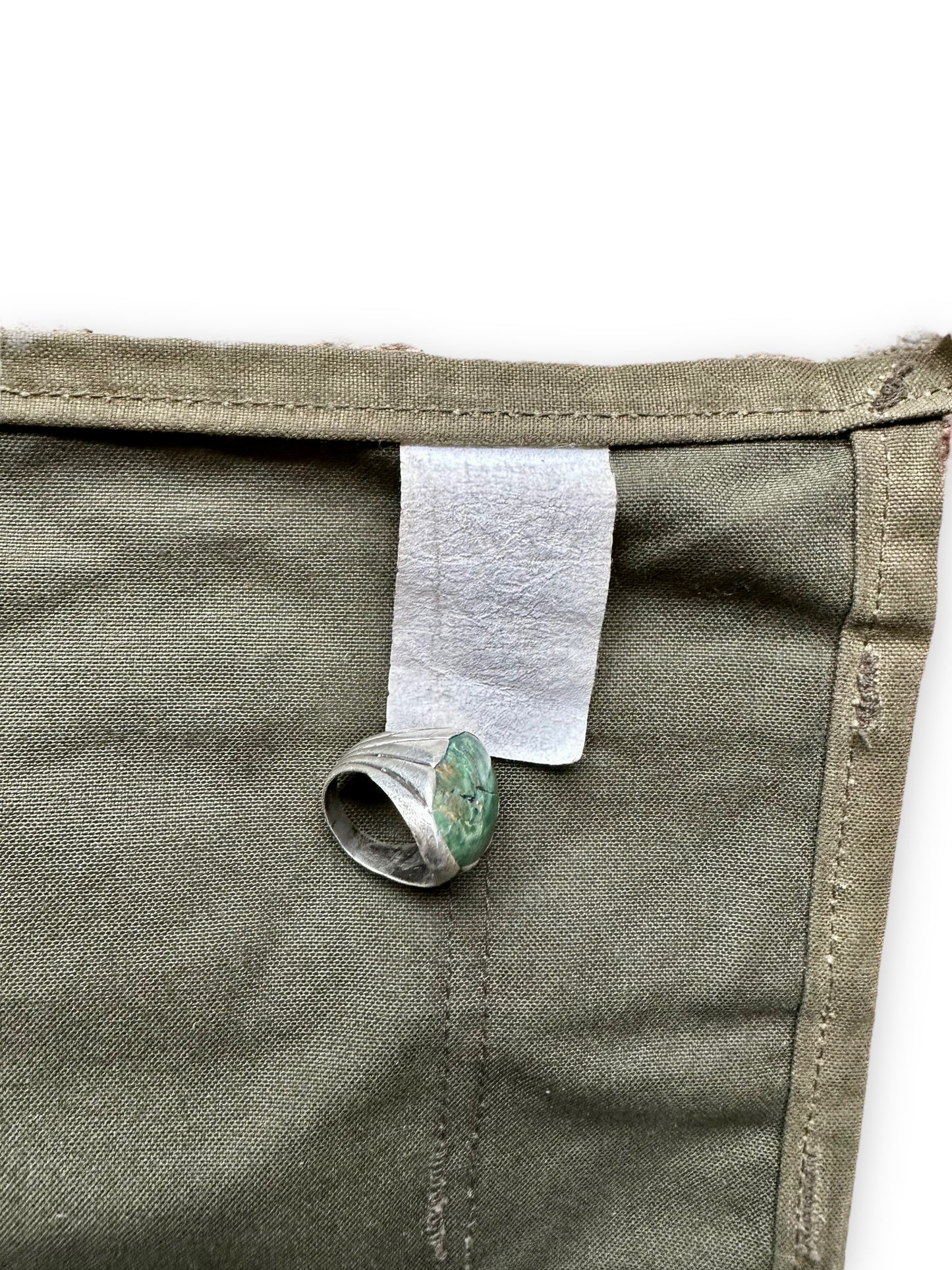 Nigh Illegible Production Tag on Filson Workshop Tool Apron SZ L | Barn Owl Vintage Goods | Vintage Workwear Seattle