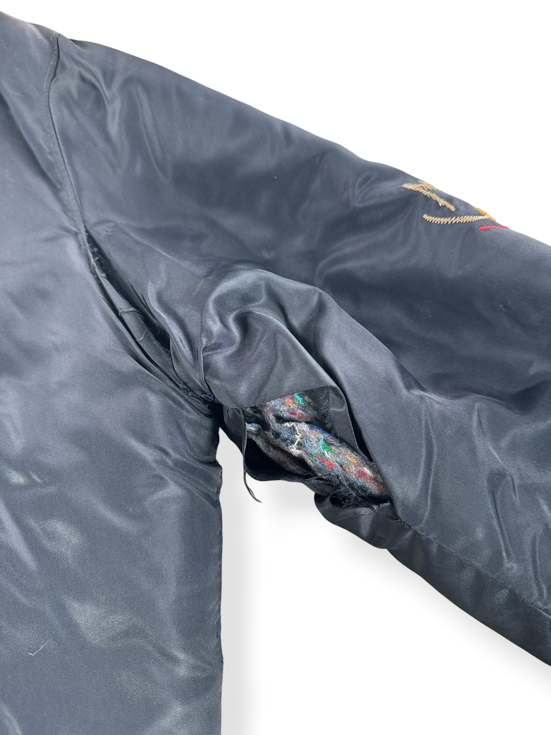 Damage on inner arm seam of Vintage '78 Korea 'Troy' Souvenir Jacket SZ L - AS IS
