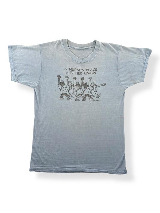 Front of Vintage A Nurse's Place Is In Her Union Tee SZ M