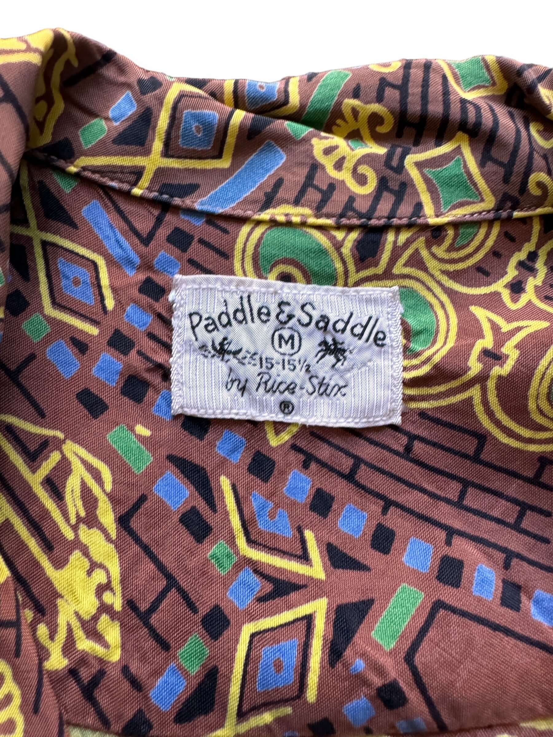 tag on Vintage Paddle and Saddle Abstract Rayon Aloha Shirt SZ M