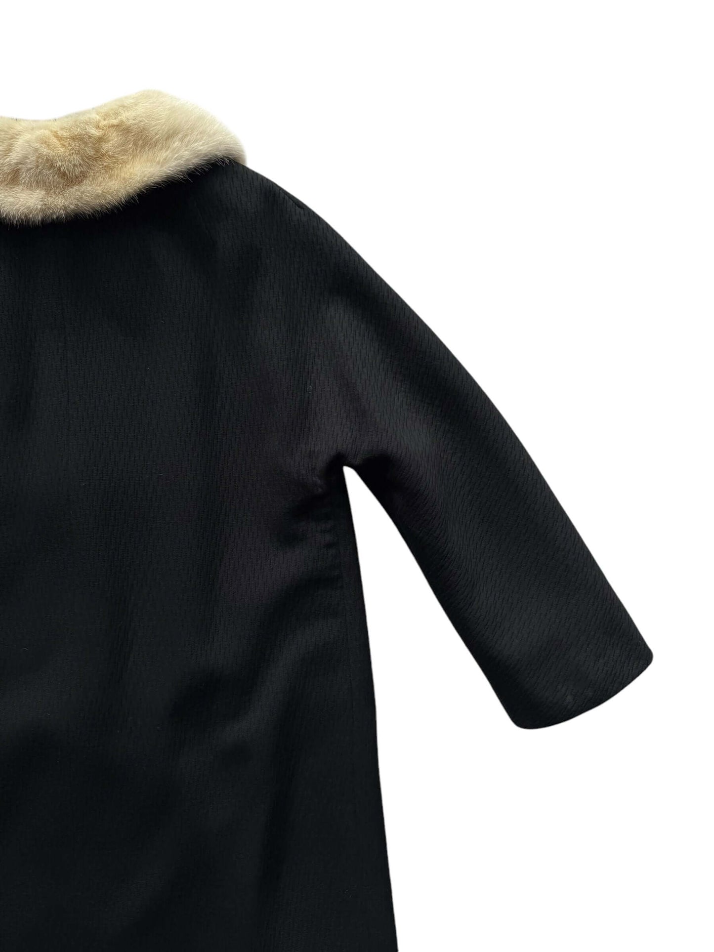 Back right arm view of 1960s Black Coat with Mink Collar M-L