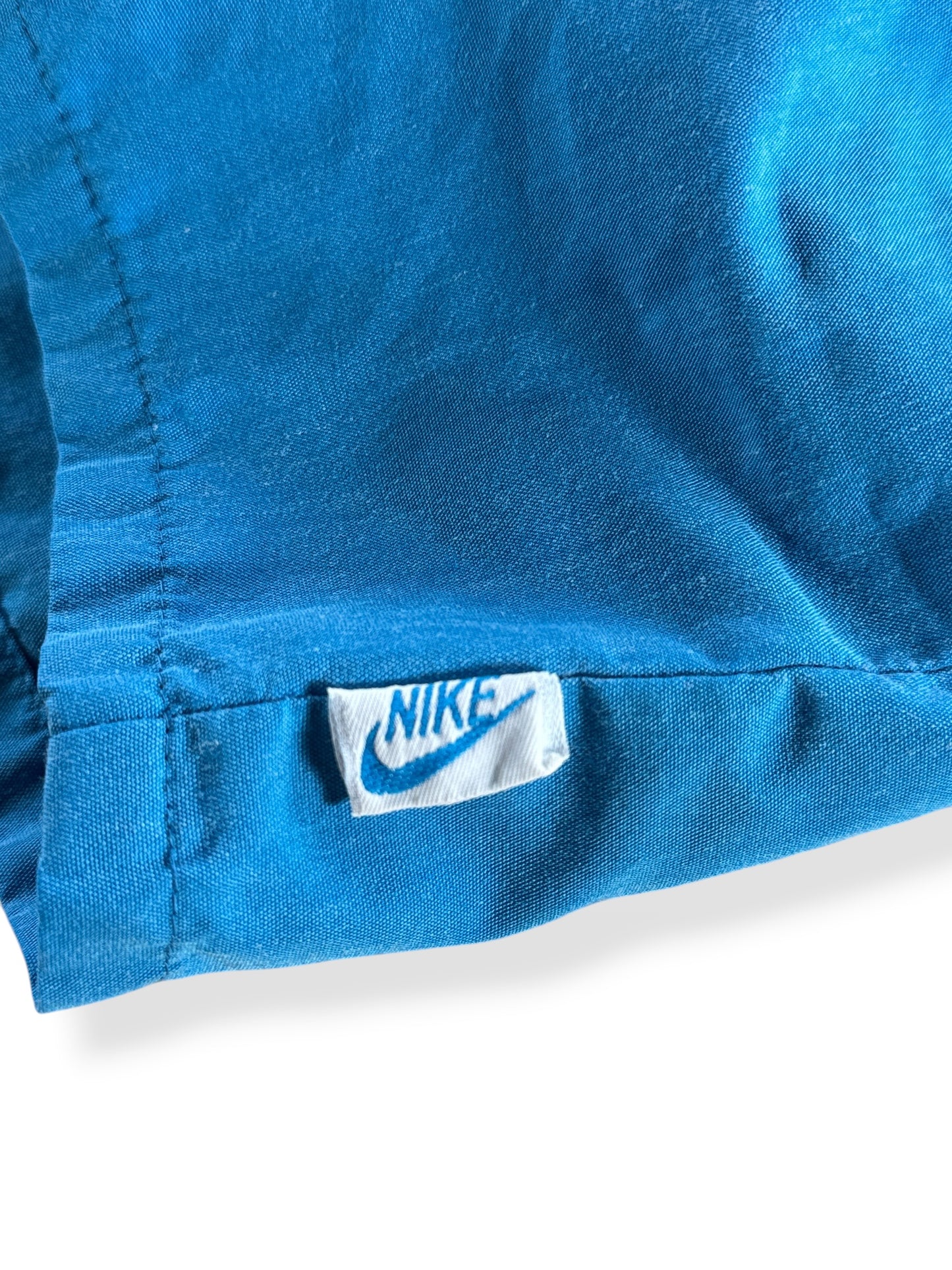 Outer Nike tag on Vintage 80s Blue Nike Shorts SZ L