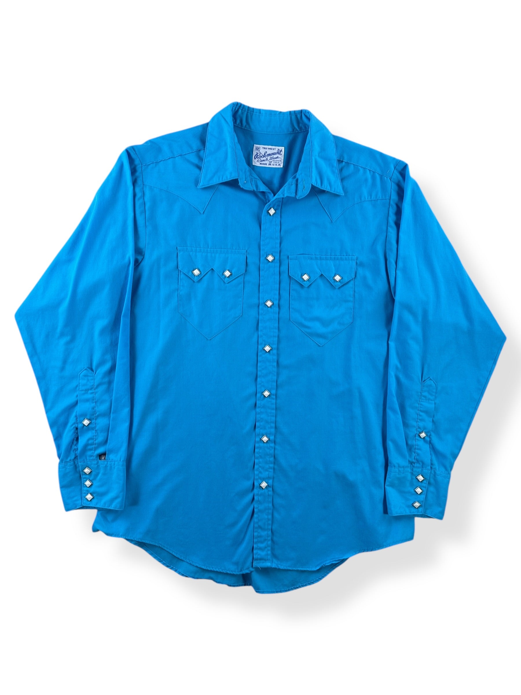 Front of Vintage Rockmount Electric Blue Pearl Snap SZ L
