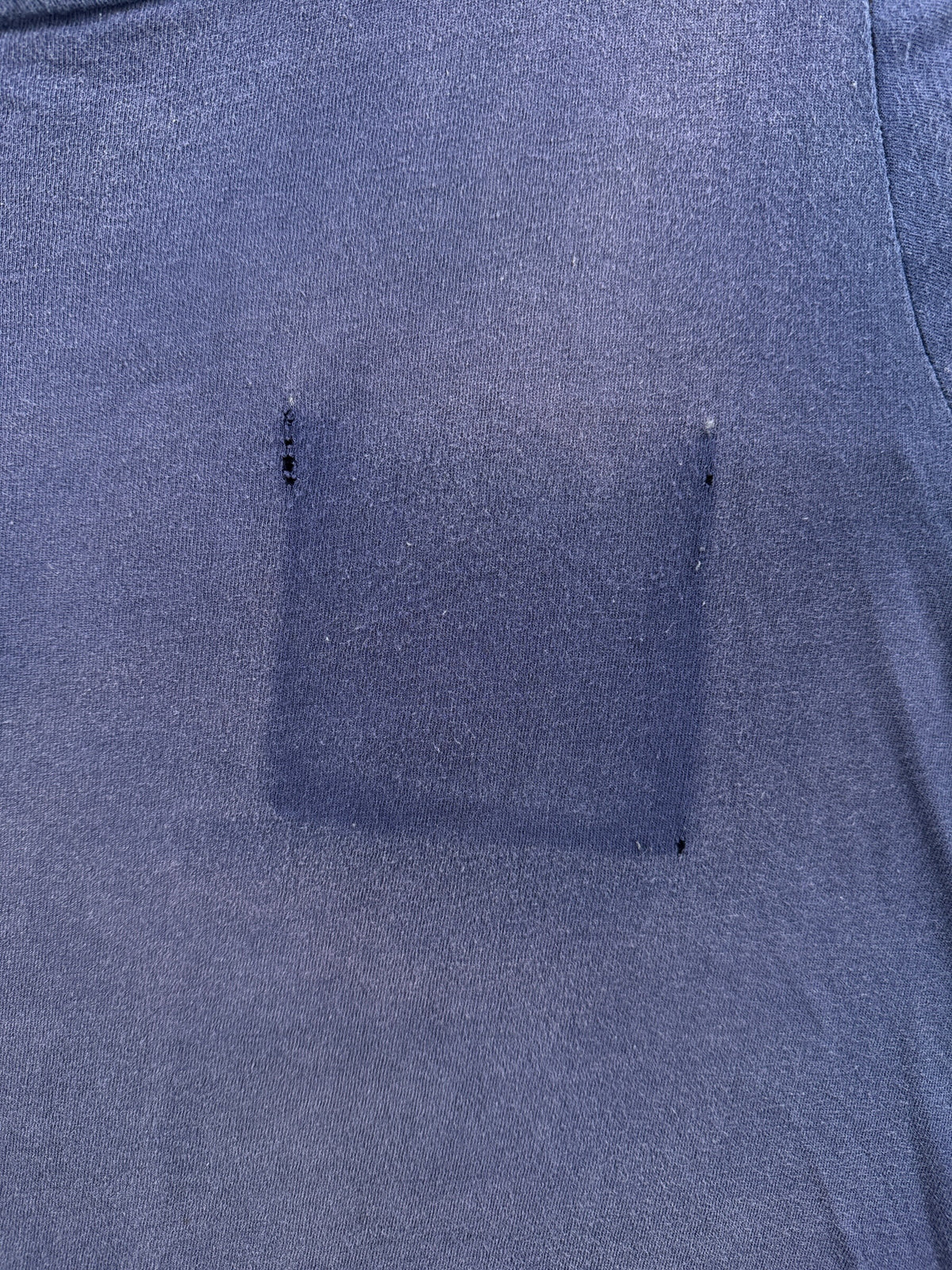Faded pocket outline on Vintage Navy Ghost Pocket Tee SZ M