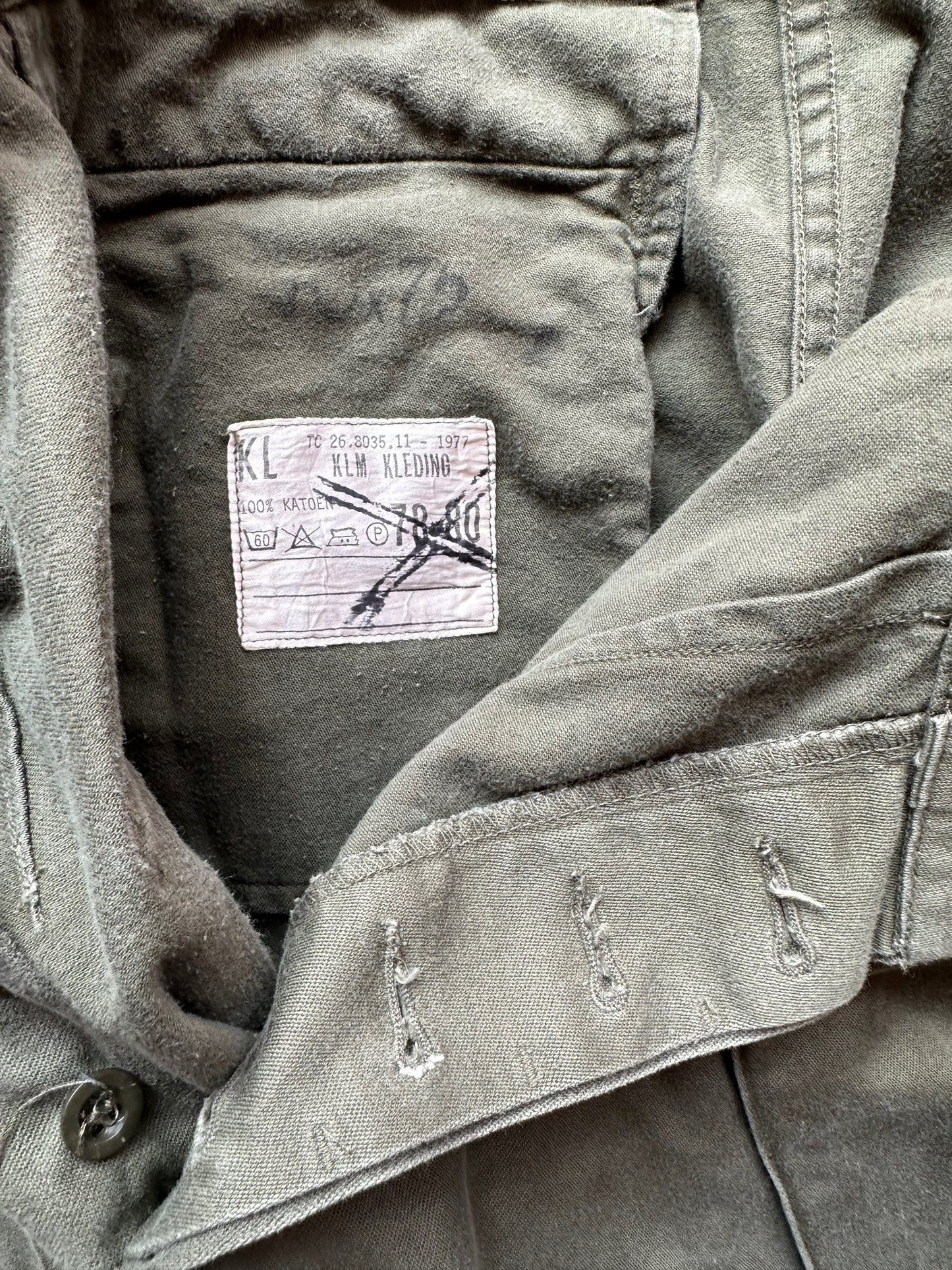 Tag View of Vintage European Workwear Cotton Trousers Olive Drab W28 | Barn Owl Vintage Seattle | Vintage Workwear Trousers Seattle
