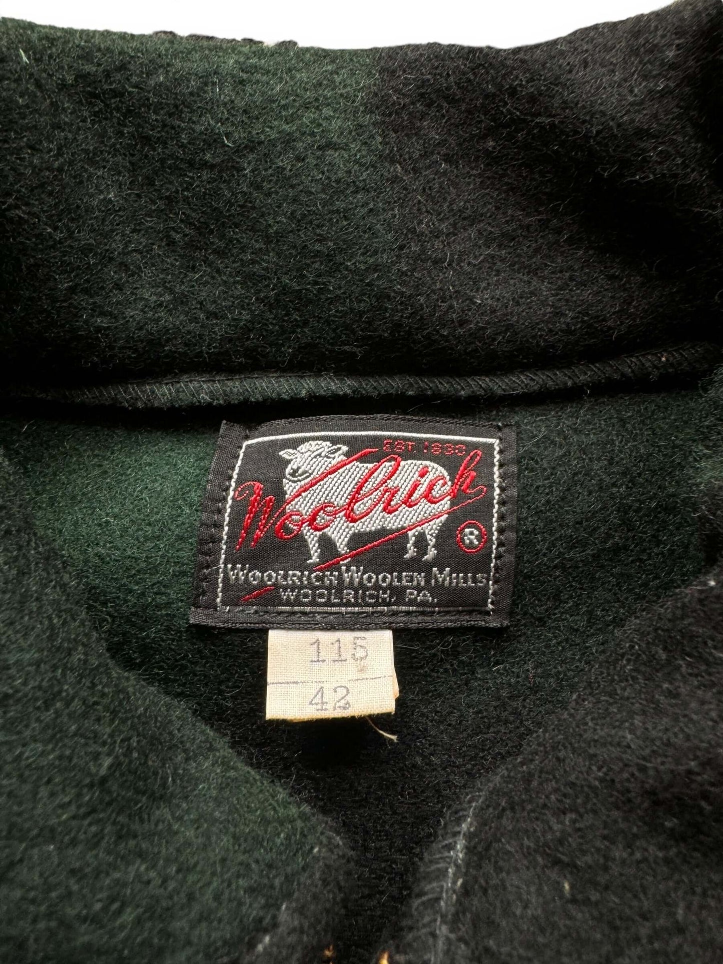 tag on NOS Woolrich Green Plaid Wool Zip Up Jacket SZ 42