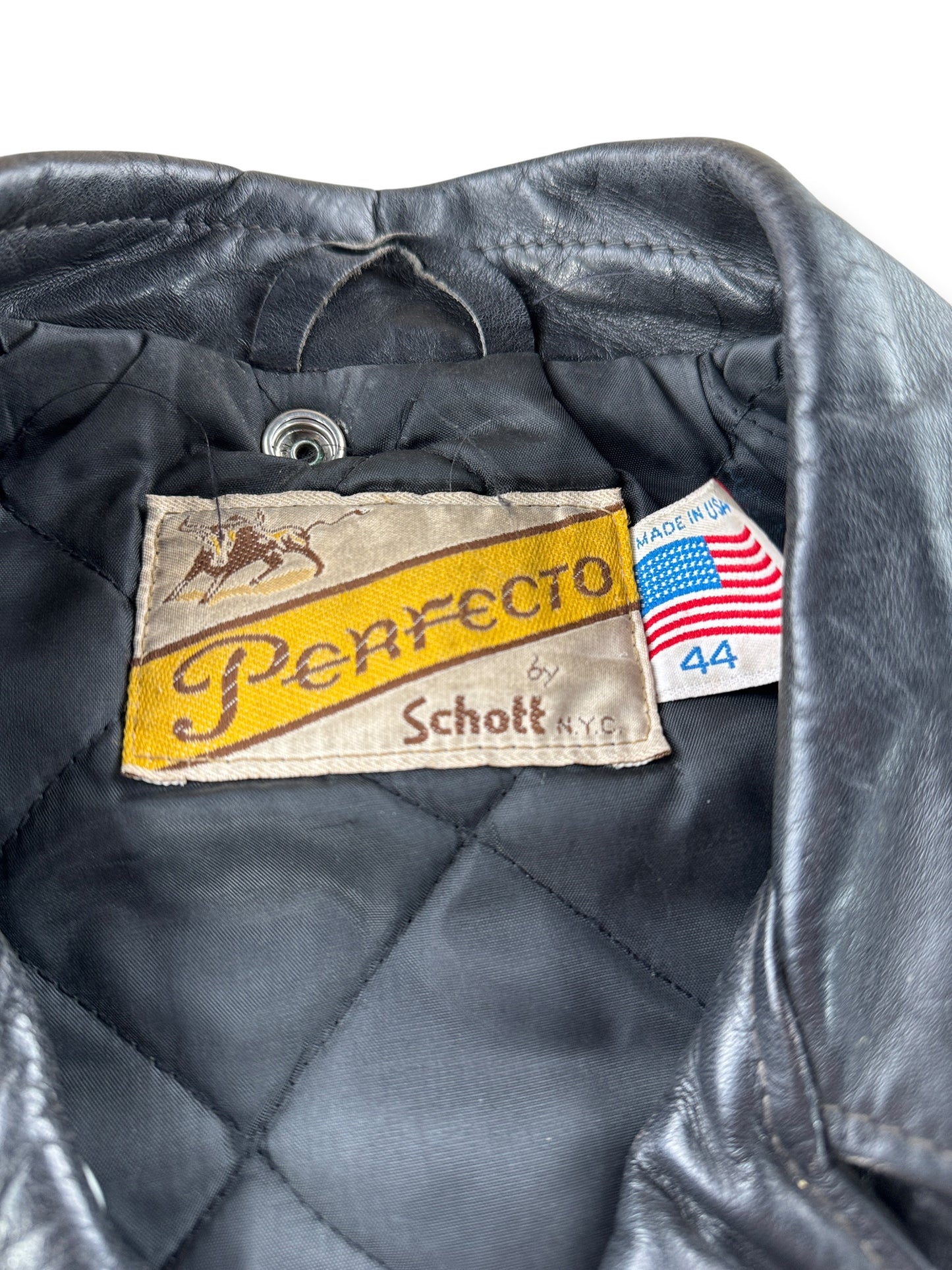 Tag on Vintage 80s Era Schott Perfecto Leather Jacket SZ 44