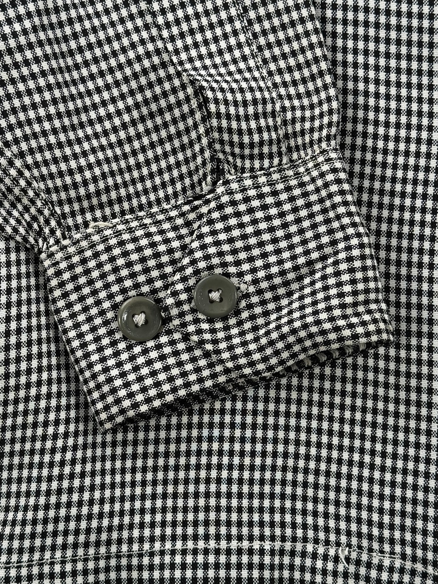 Cuff buttons on Vintage 1950s Sterling Black and White Rayon Loop Collar Shirt SZ M