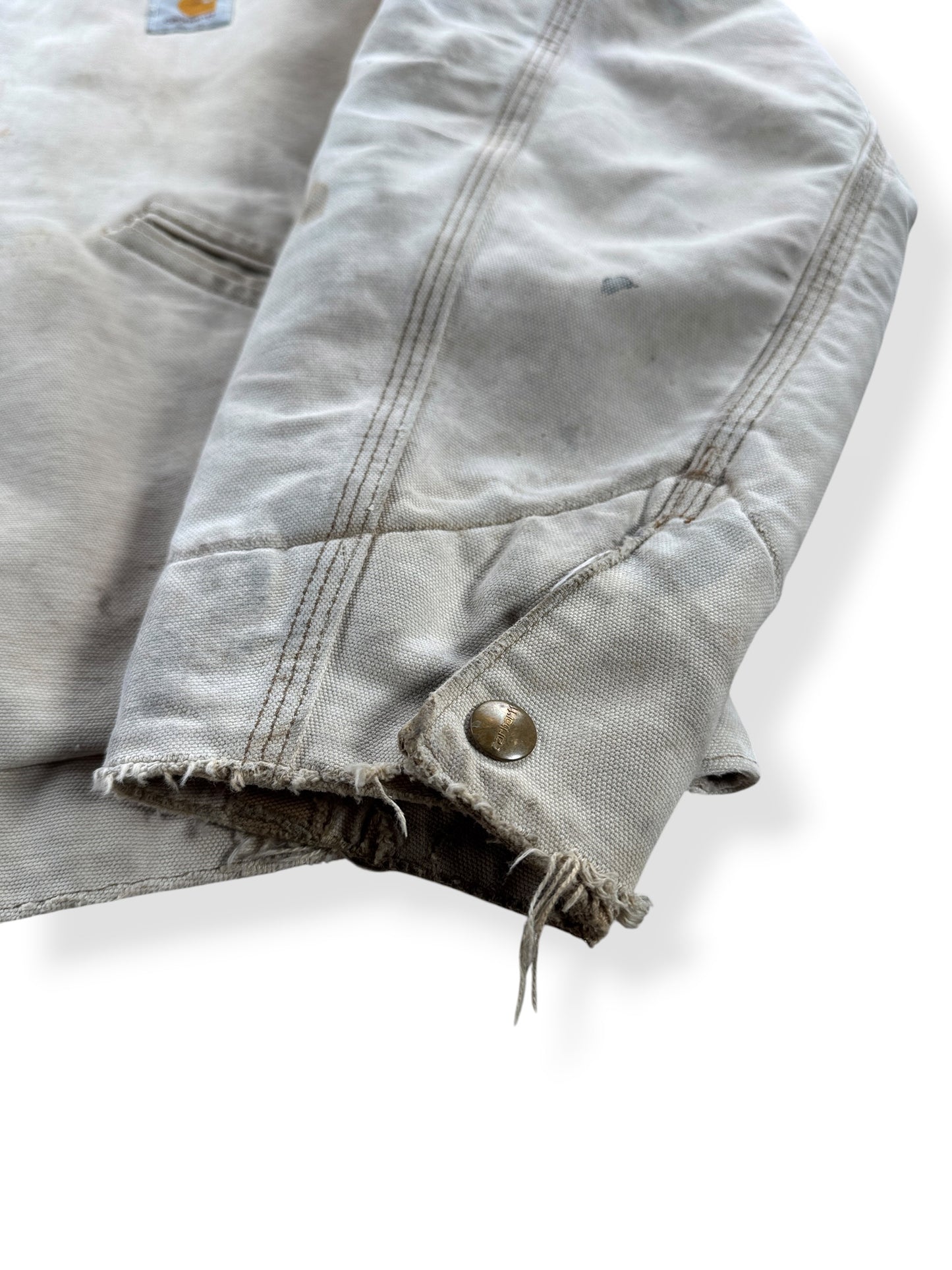 Fraying on cuff of Vintage 90’s Carhartt Faded Tan Detroit Jacket SZ XL