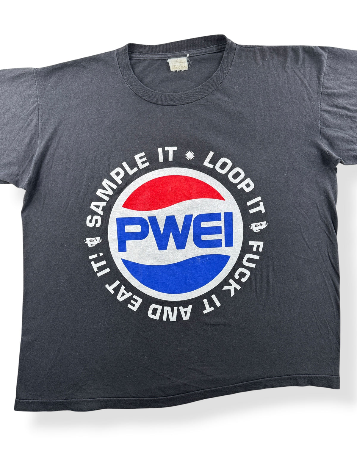 Close-up of Vintage PWEI Band Tee SZ XL